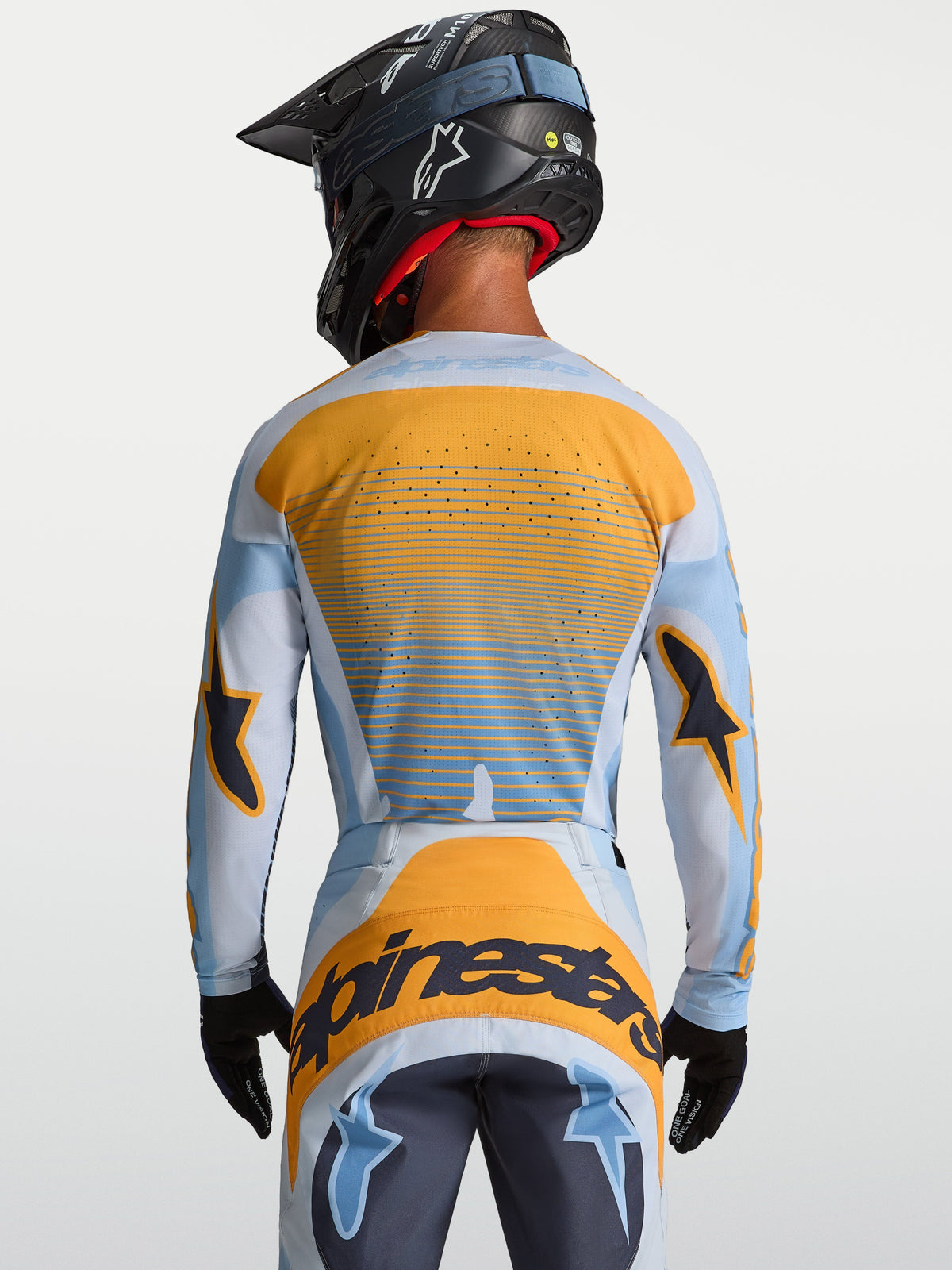 Koszulka Alpinestars Techstar Maven, męska koszulka motocrossowa, niebieska i pomarańczowa, tył z laserową wentylacją.