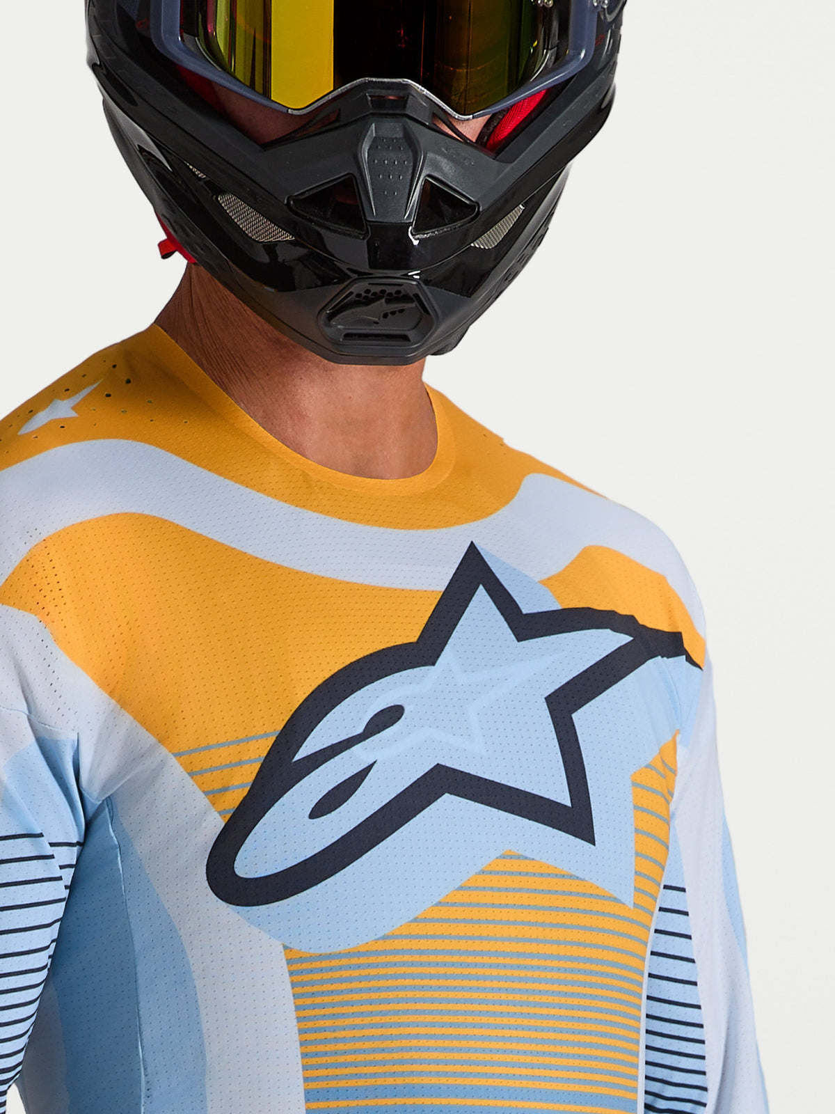 Koszulka Alpinestars Techstar Maven, męska, niebieska i pomarańczowa, laserowe perforacje, logo Astars, styl motocrossowy.