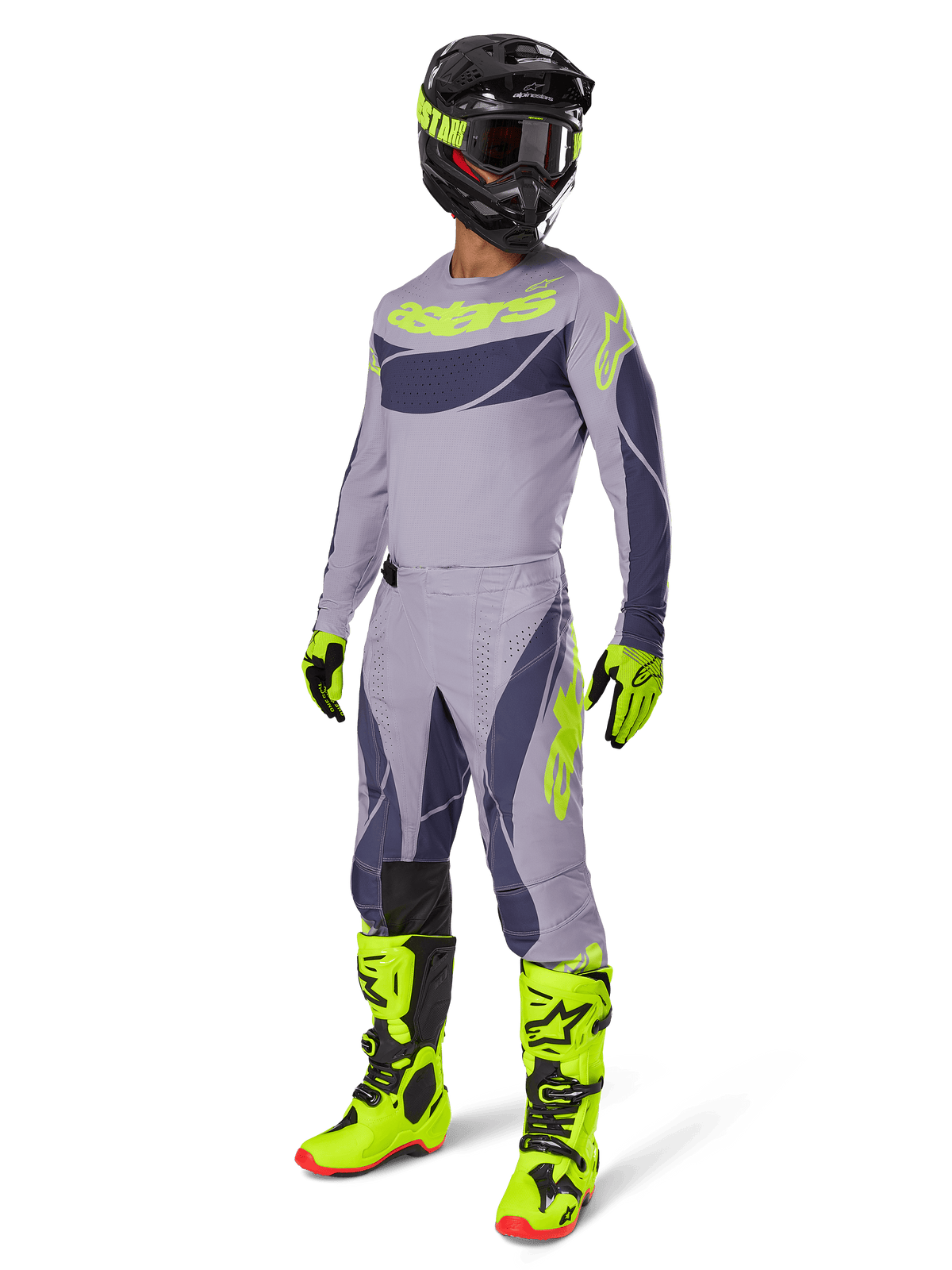 Motocross rider wearing the 2025 Techstar Dreem Jersey in gray and dark gray with neon yellow accents, complete racing gear set including matching gray pants, neon yellow boots and gloves, and a black helmet, coordinated off-road performance outfit