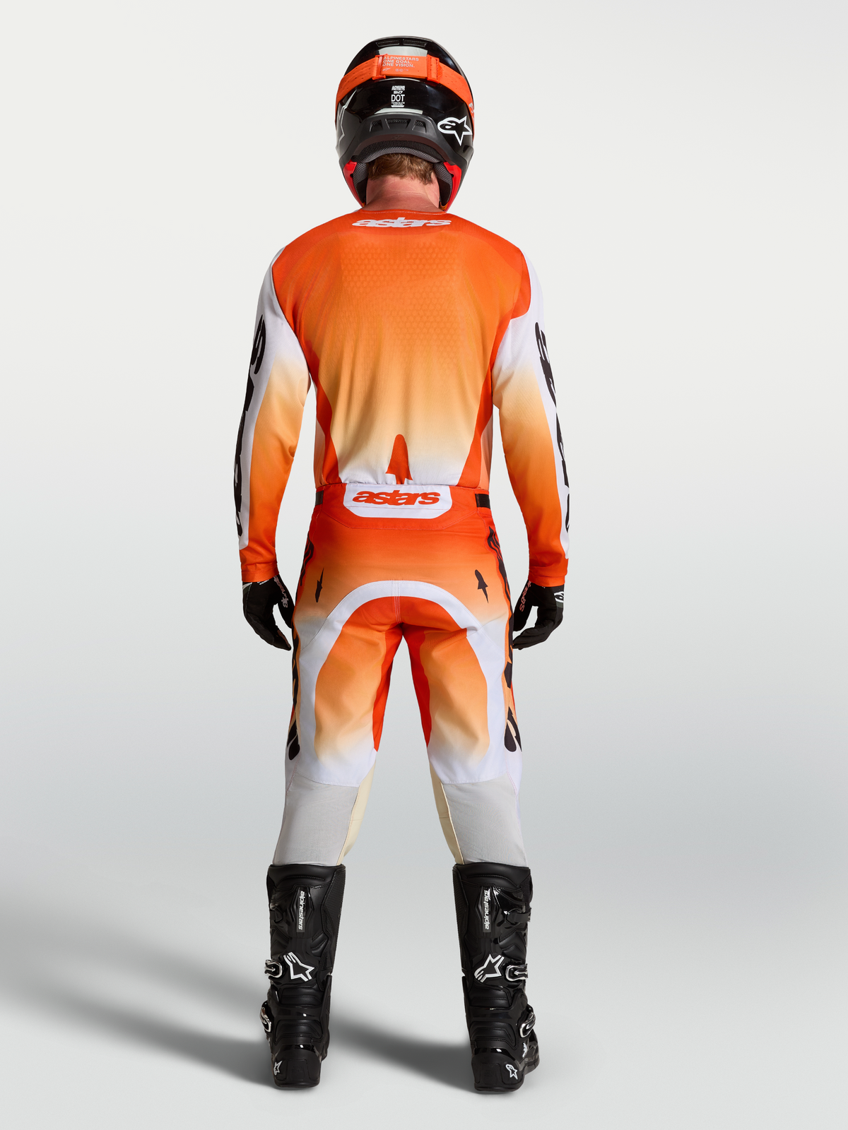 Alpinestars Racer Amber, spodnie i zestaw, męski strój motocrossowy, pomarańczowy i biały, widok z tyłu.