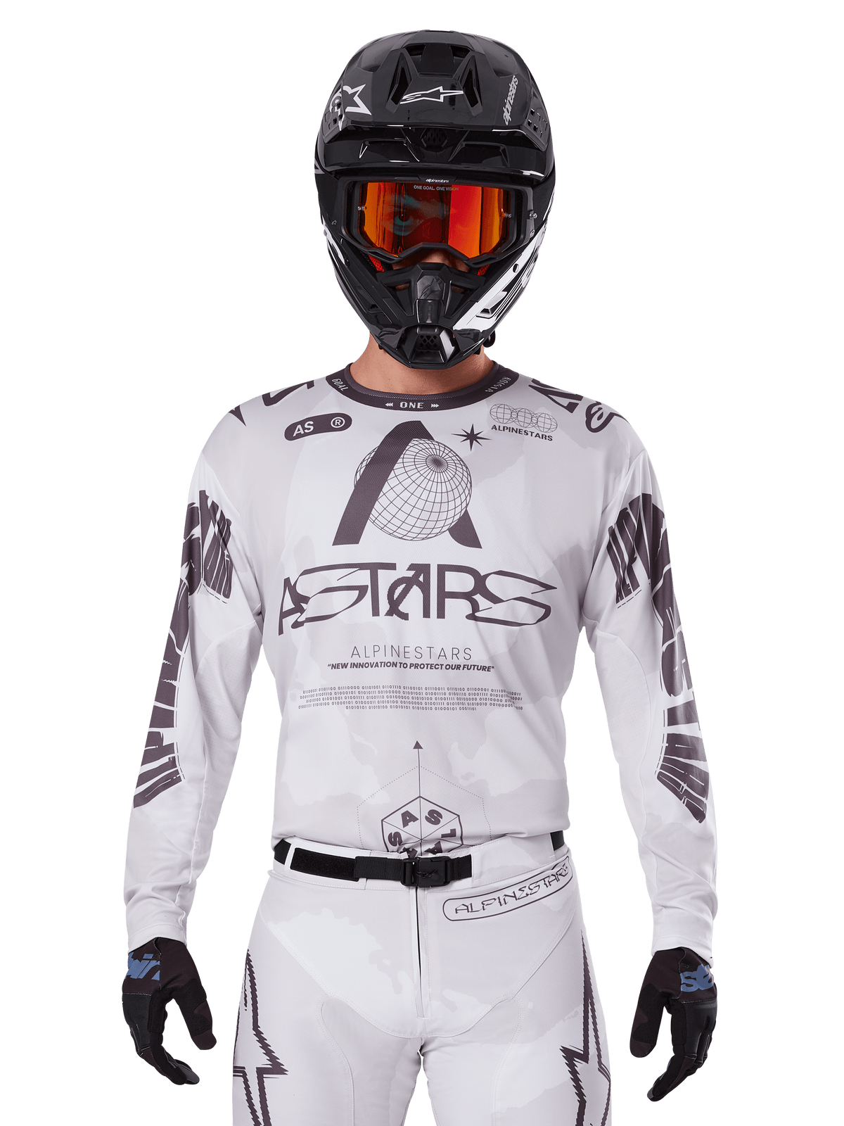 Alpinestars 2025 Racer Hollow Jersey, Motocross Jersey, White and Black, worn with matching white MX pants and a black helmet with orange goggles, featuring bold Alpinestars branding and globe graphics, professional off-road racing gear
