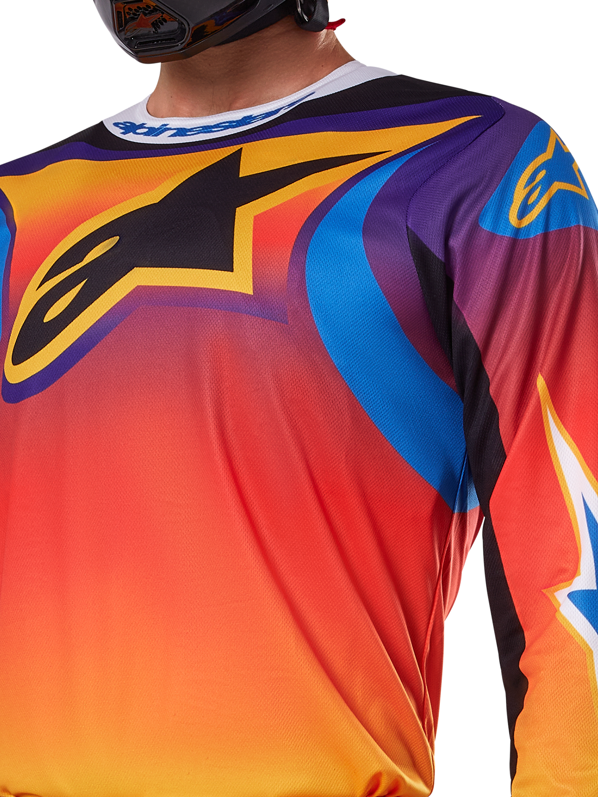 Alpinestars 2025 Fluid Wurx Jersey, wielokolorowy biało-pomarańczowy design, koszulka motocrossowa z długim rękawem, swobodny krój sportowy, odprowadzająca wilgoć polifabryka zapewniająca wydajność w terenie