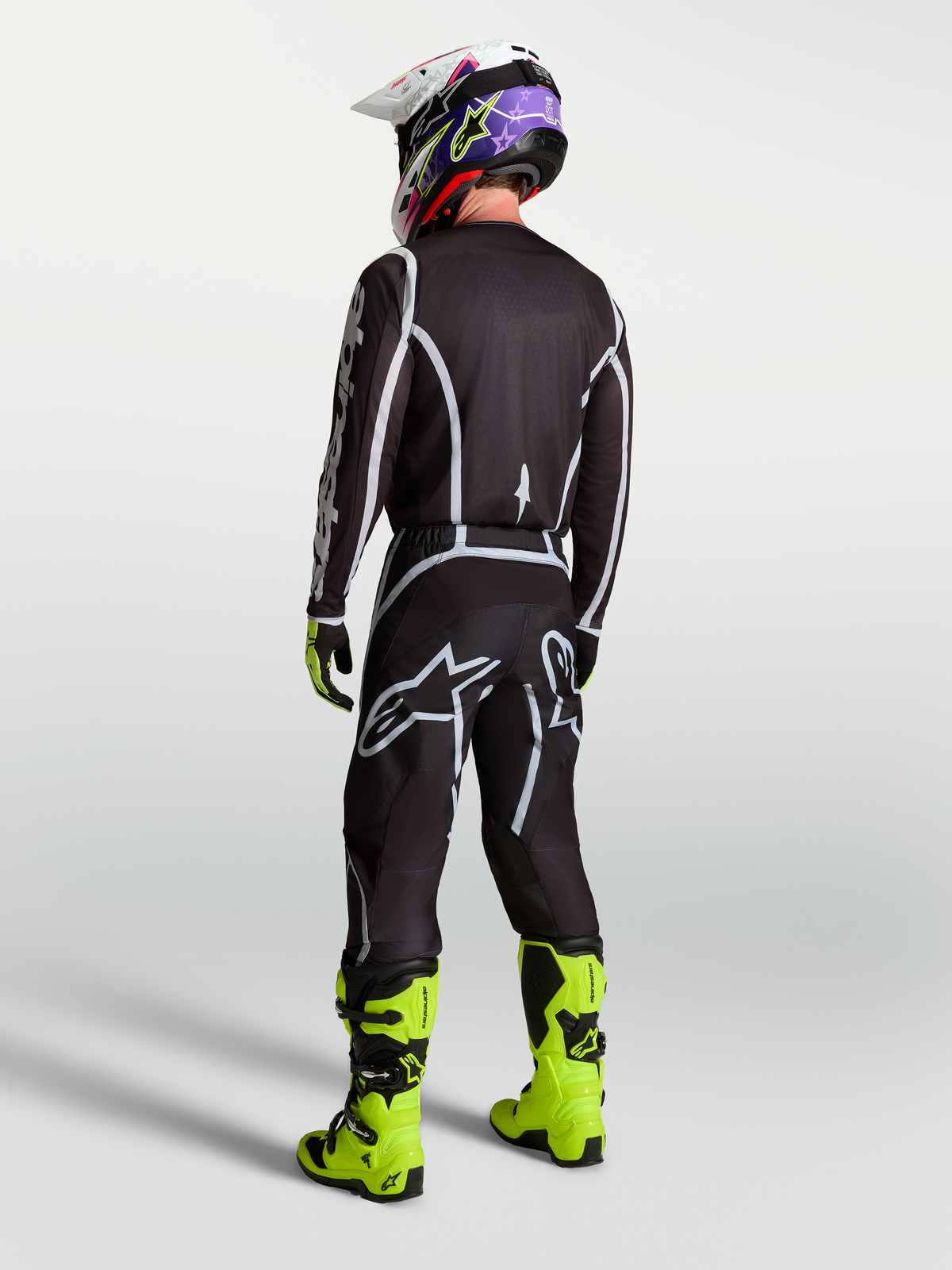 Alpinestars koszulka Fluid Apex V2, męska koszulka motocrossowa, czarna i srebrna, sportowy krój widoczny z tyłu.