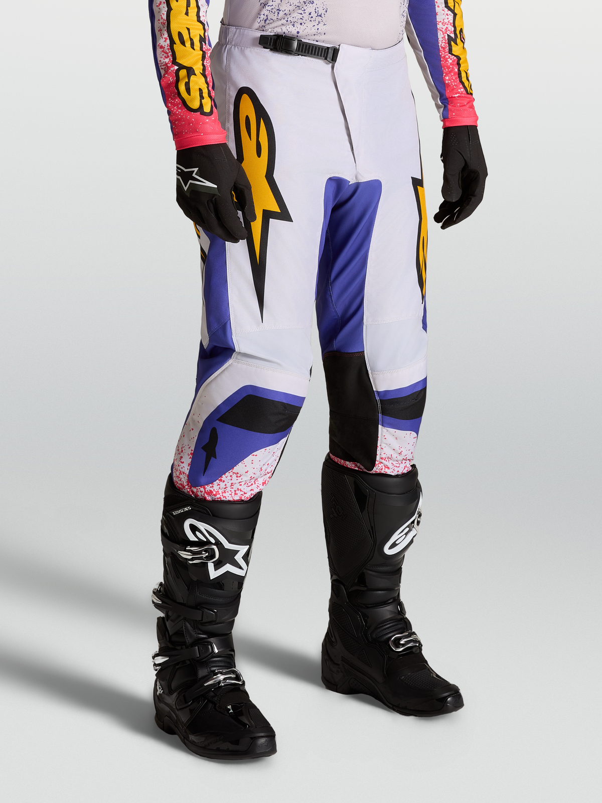 Alpinestars Spodnie Fluid Drag, męskie spodnie motocrossowe, błękitne i jasnofioletowe ze złotą grafiką, sportowy krój off-road