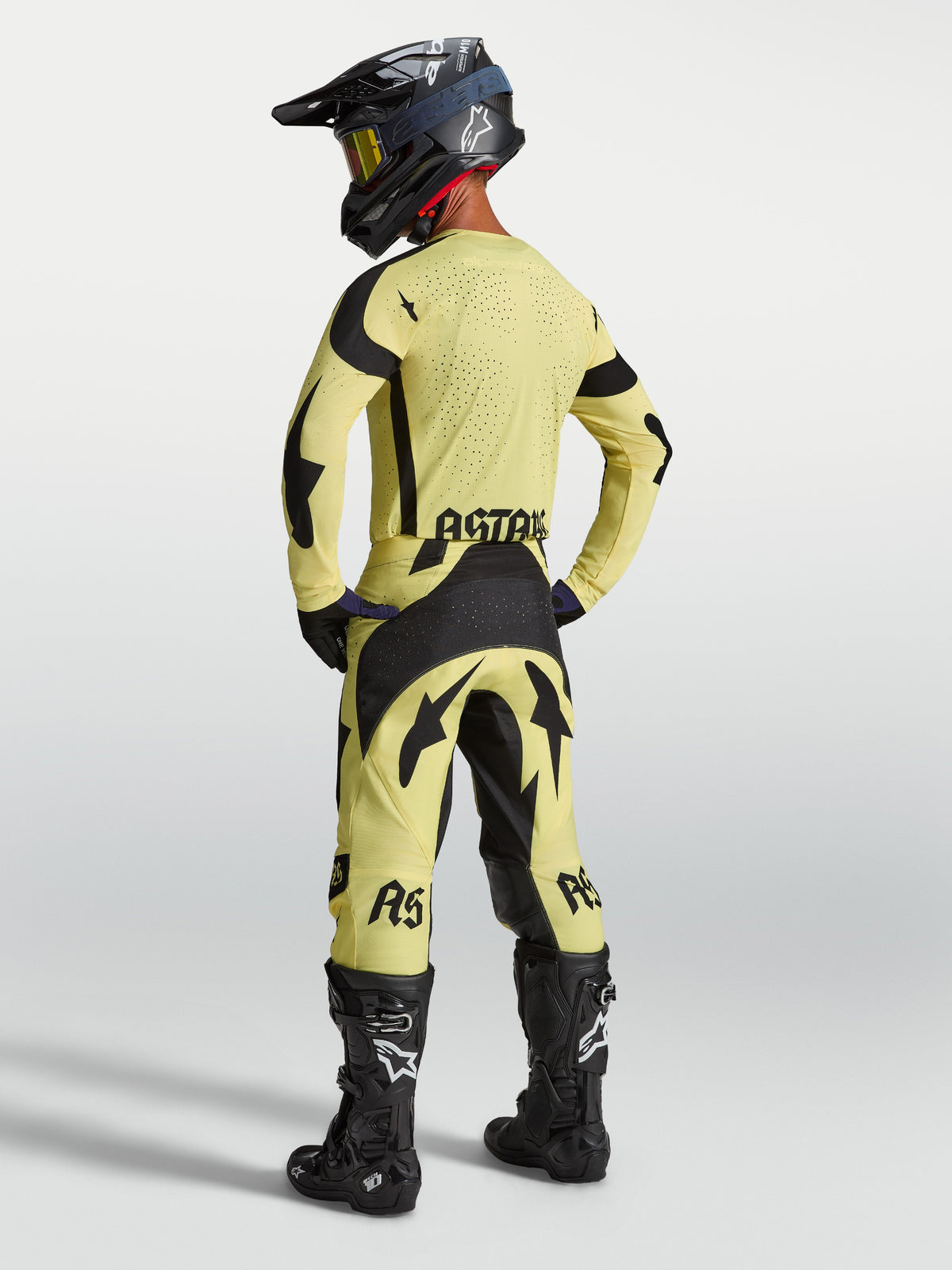 Koszulka Techstar Atrox Alpinestars, męska koszulka motocrossowa, żółta i czarna, laserowo wycinana wentylacja, widok z tyłu.