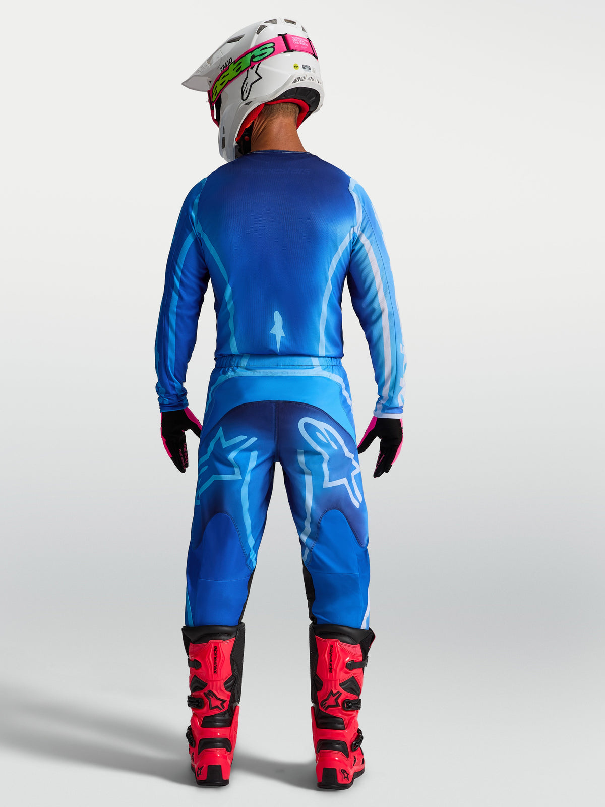 Alpinestars koszulka Fluid Kepler, niebieska męska koszulka motocrossowa, lekki i oddychający materiał z przedłużonym tyłem, widok z tyłu