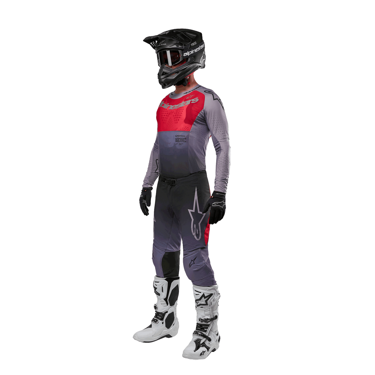 Motocross rider wearing complete racing gear, Alpinestars 2024 Supertech Dade Jersey in Iron Red Berry and grey, matching grey pants with red accents, black helmet with goggles, white and black boots, black gloves, coordinated outfit for off-road racing