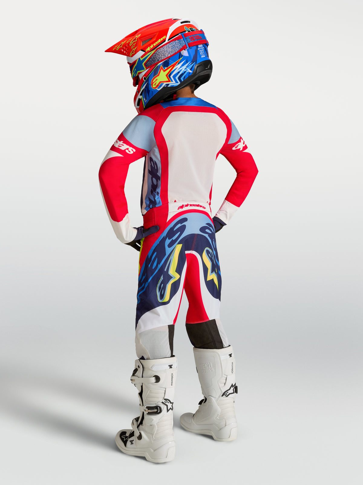 Alpinestars Supertech Dyna, młodzieżowy zestaw MX, czerwony, biały i granatowy, krój wyścigowy, widok z tyłu