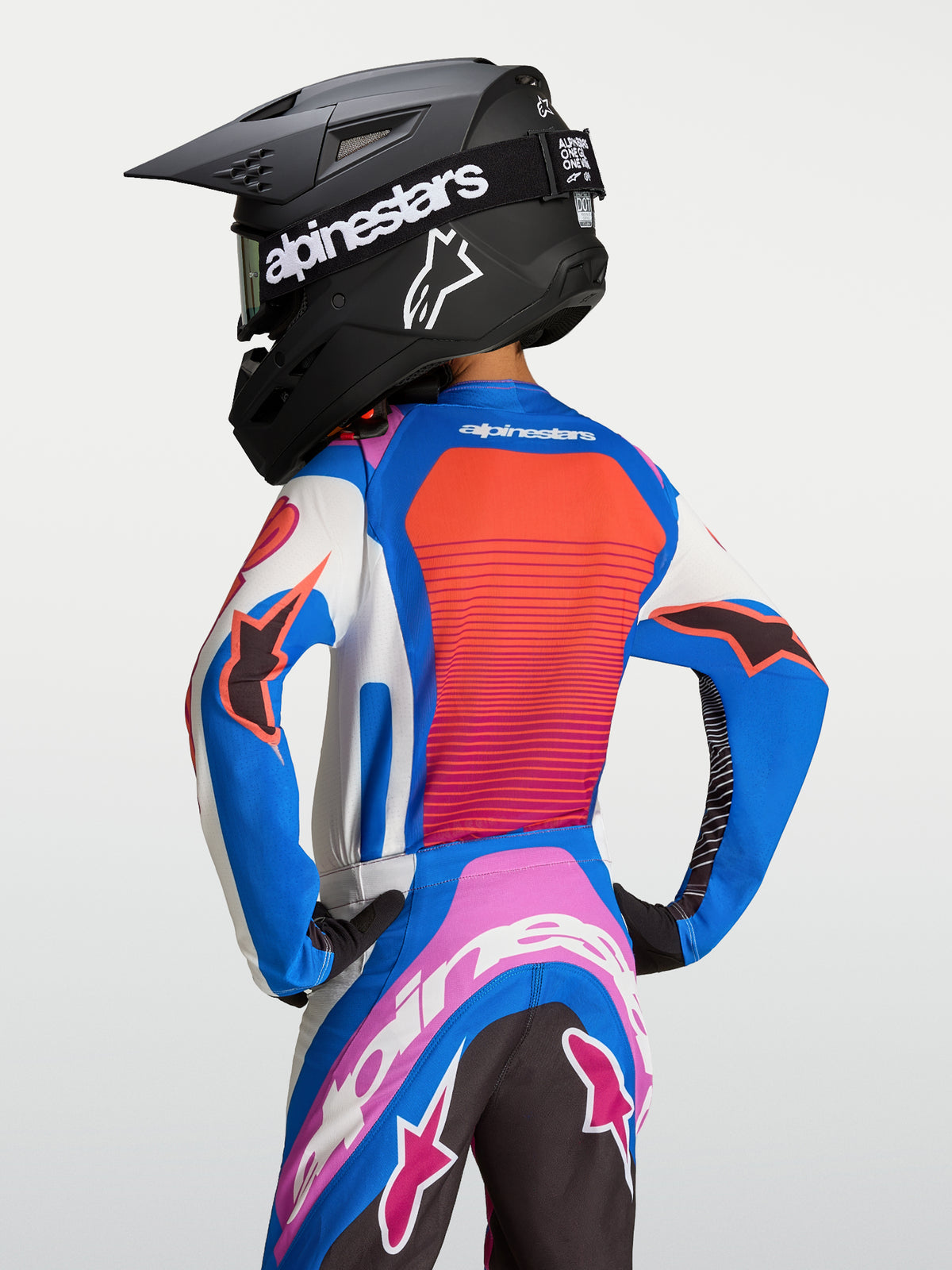 Alpinestars Koszulka Supertech Maven Młodzieżowa, niebiesko-koralowa, wentylowana siatka i krój wyścigowy motocross.