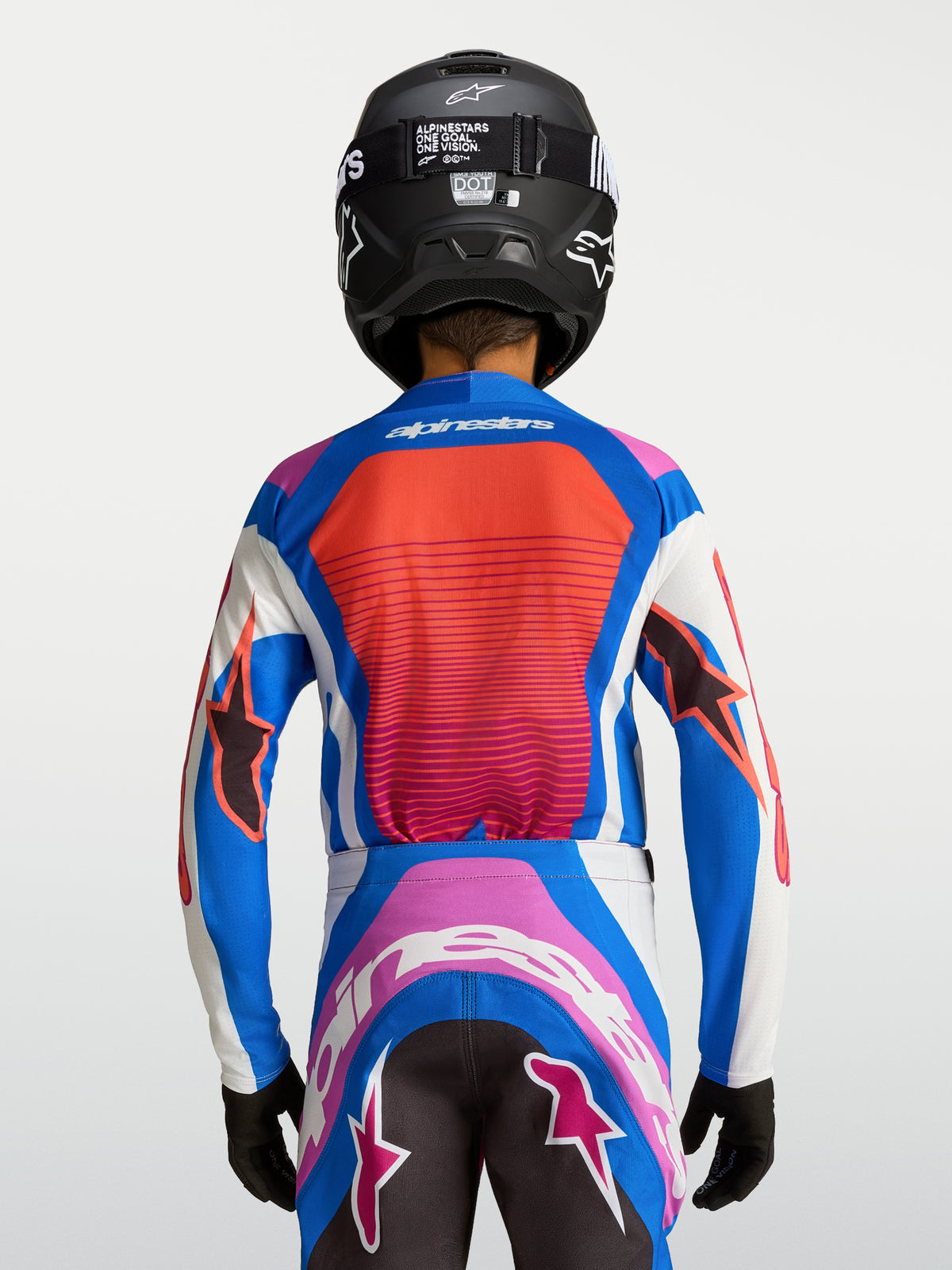 Alpinestars Koszulka Supertech Maven Młodzieżowe, niebieska i koralowa koszulka MX z oddychającej siatki, widok z tyłu.