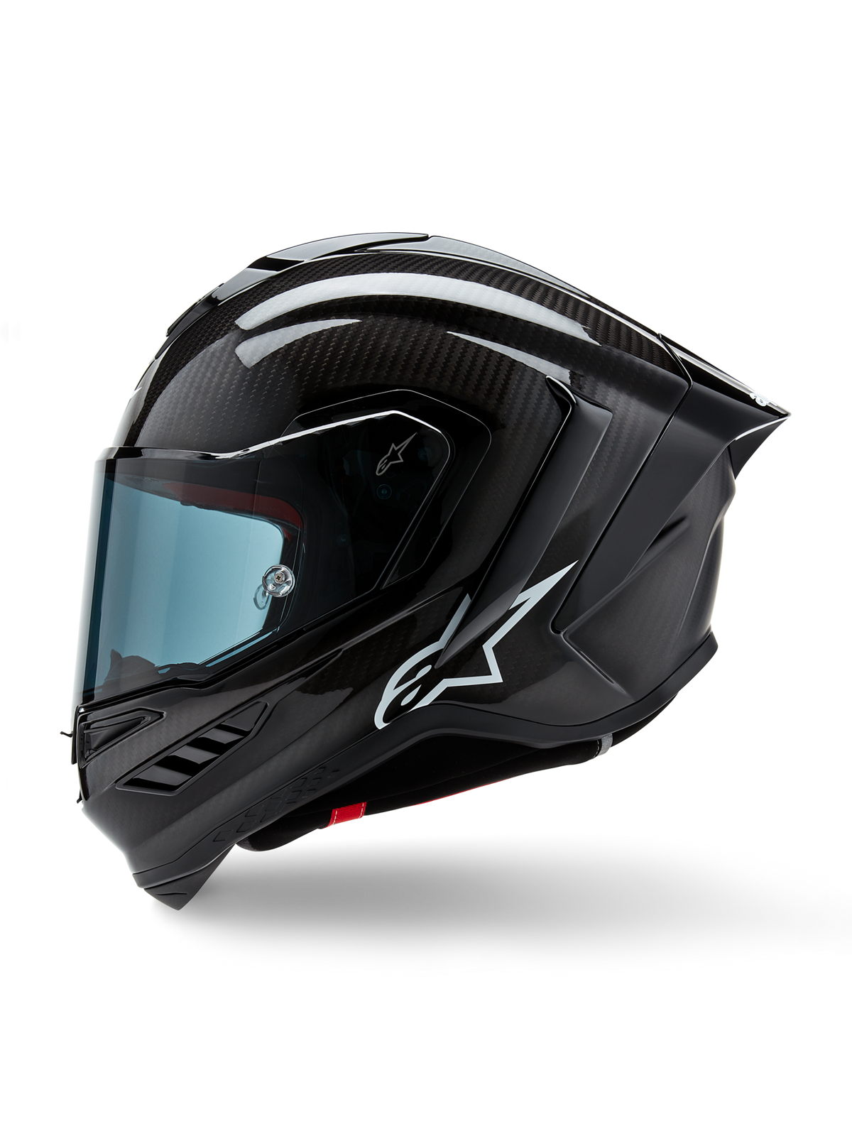 Alpinestars Supertech R10 Solid Helmet, Full-Face Motorcycle Racing Helmet, Black Carbon Matte and Glossy, visible carbon fiber weave pattern, white Alpinestars logo on the side, aerodynamic design with integrated rear spoiler and ventilation ports, side profile view