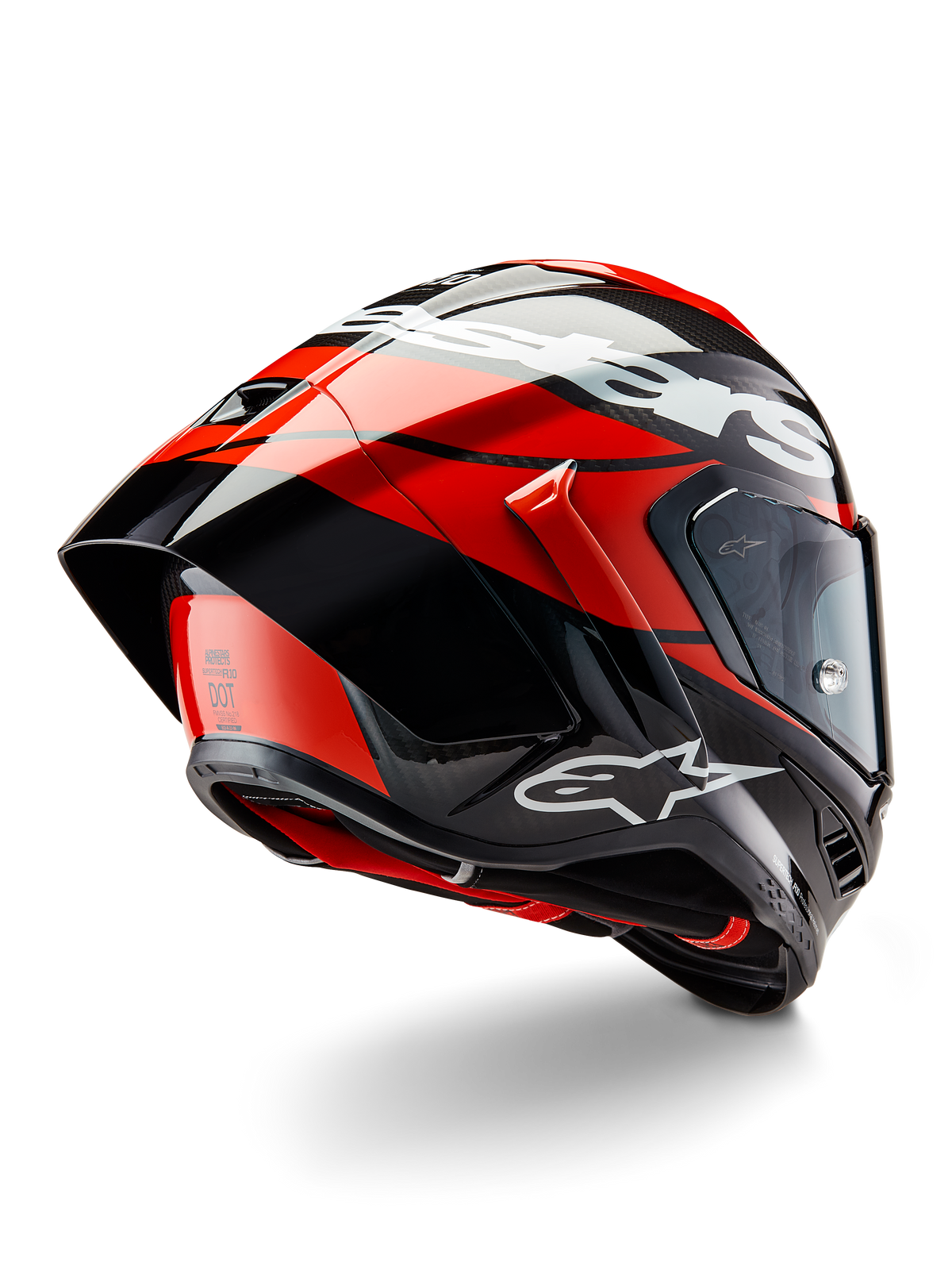 Alpinestars Supertech R10 Element Helmet, Black Carbon Bright Red and White Glossy, rear-three-quarter view showing large aerodynamic spoiler and carbon fiber shell, featuring bold Alpinestars logos and DOT certification