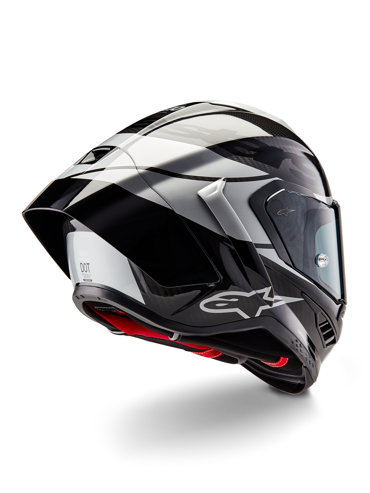 Alpinestars Supertech R10 Element Helmet, Black Carbon Silver Black Glossy, rear three-quarter view showing aerodynamic racing profile, glossy carbon fiber shell with geometric grey and black graphics, Alpinestars logo, and red interior padding