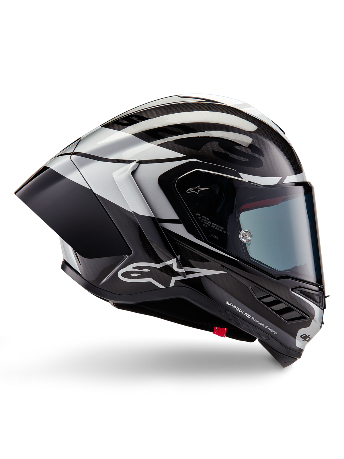 Alpinestars Supertech R10 Element Helmet, Full-Face Motorcycle Racing Helmet, Black Carbon, Silver, and Black Glossy finish, side profile view featuring aerodynamic carbon fiber shell, clear visor, and bold Alpinestars branding