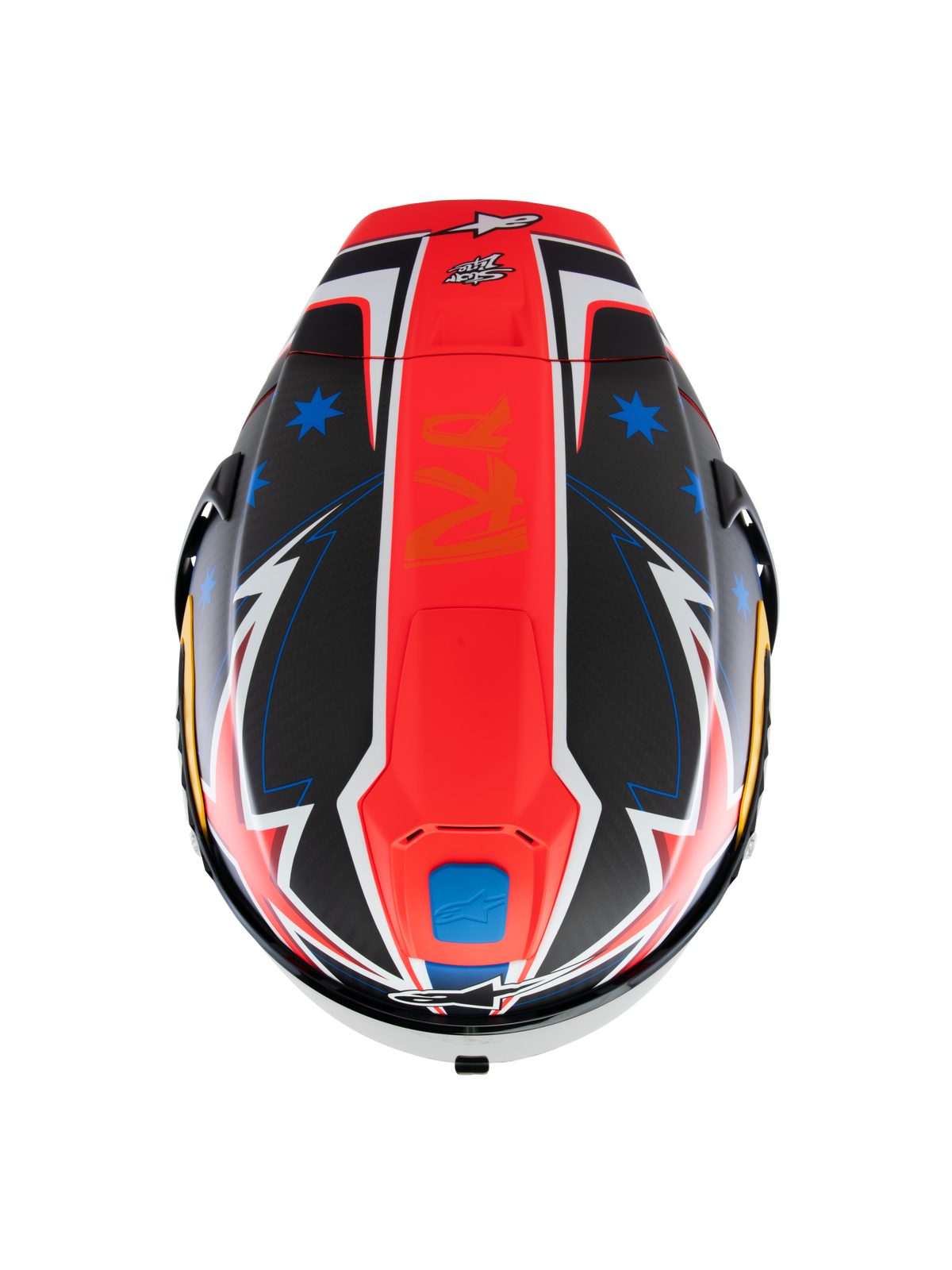 Kask Alpinestars Supertech R10 Miller Limited Edition, widok z góry, matowa grafika Carbon Red z centralnym czerwonym pasem, niebieskie gwiazdy na sekcjach z czarnego włókna węglowego, białe i niebieskie akcenty w stylu błyskawic, aerodynamiczny design wyścigowy