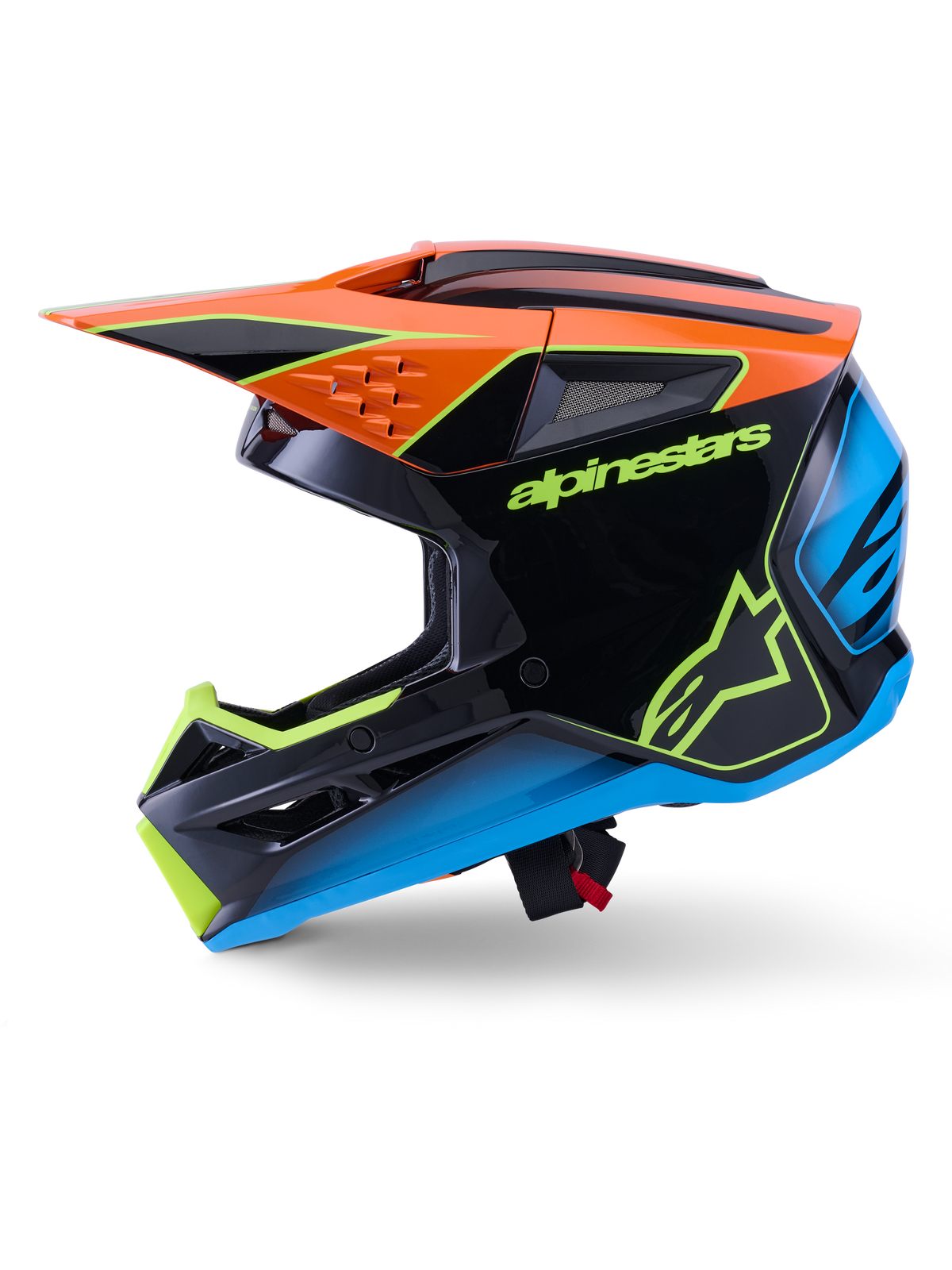 Kask Alpinestars S-M3 Fray ECE 22.06, kask motocrossowy, czarny z pomarańczowymi, niebieskimi i jaskrawożółtymi akcentami, widok z profilu prezentujący aerodynamiczną skorupę i zintegrowane otwory wentylacyjne, wyraźne logo Alpinestars, profesjonalna ochrona do jazdy w terenie