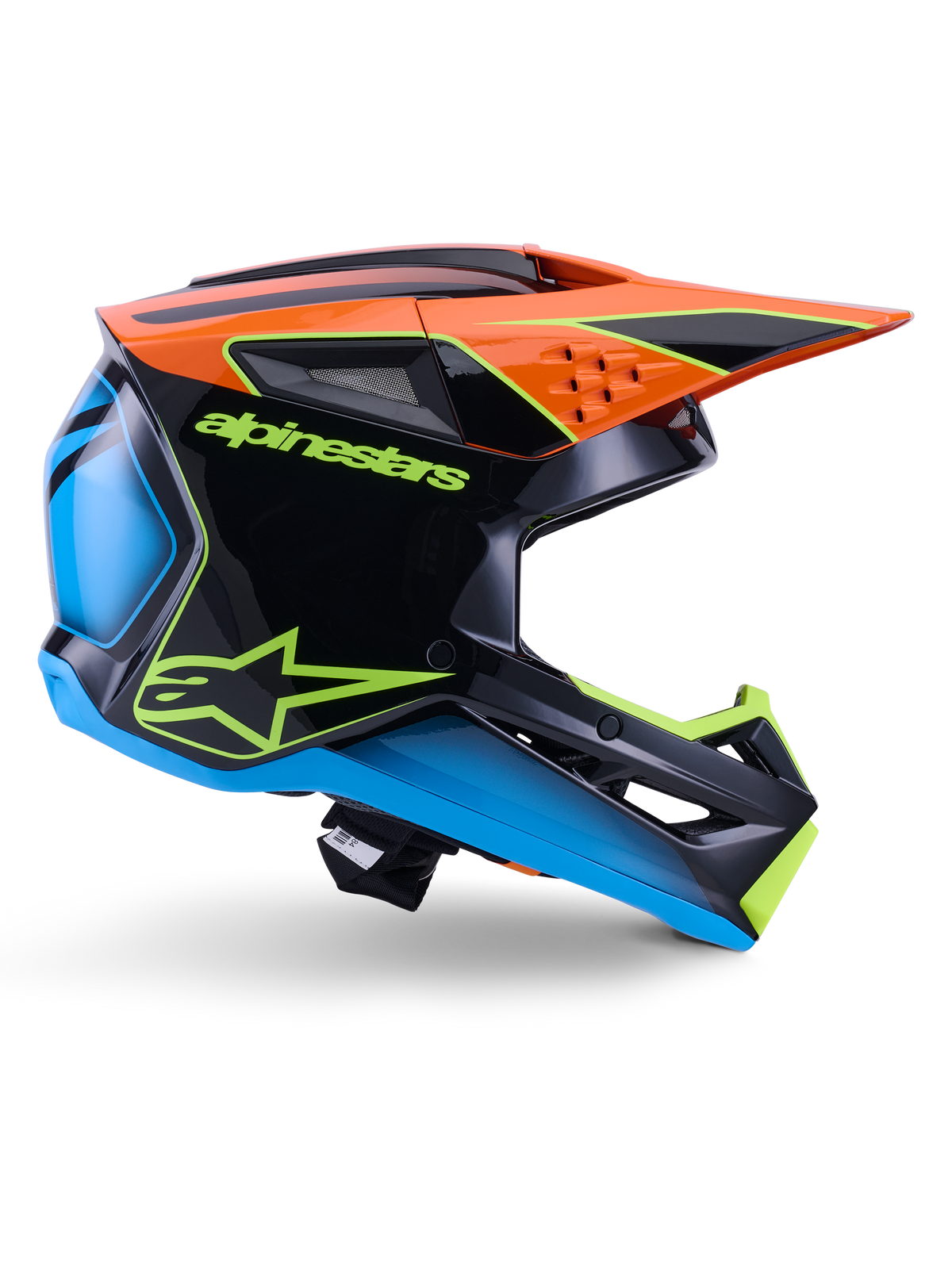 Alpinestars S-M3 Fray Helmet ECE 22.06, kask motocrossowy, czarny, pomarańczowy, niebieski i neonowy żółty, boczny profil błyszczącej aerodynamicznej skorupy z wyraźnym pomarańczowym daszkiem, neonowo-zielone logo i niebieskie akcenty, ochrona do wyścigów terenowych