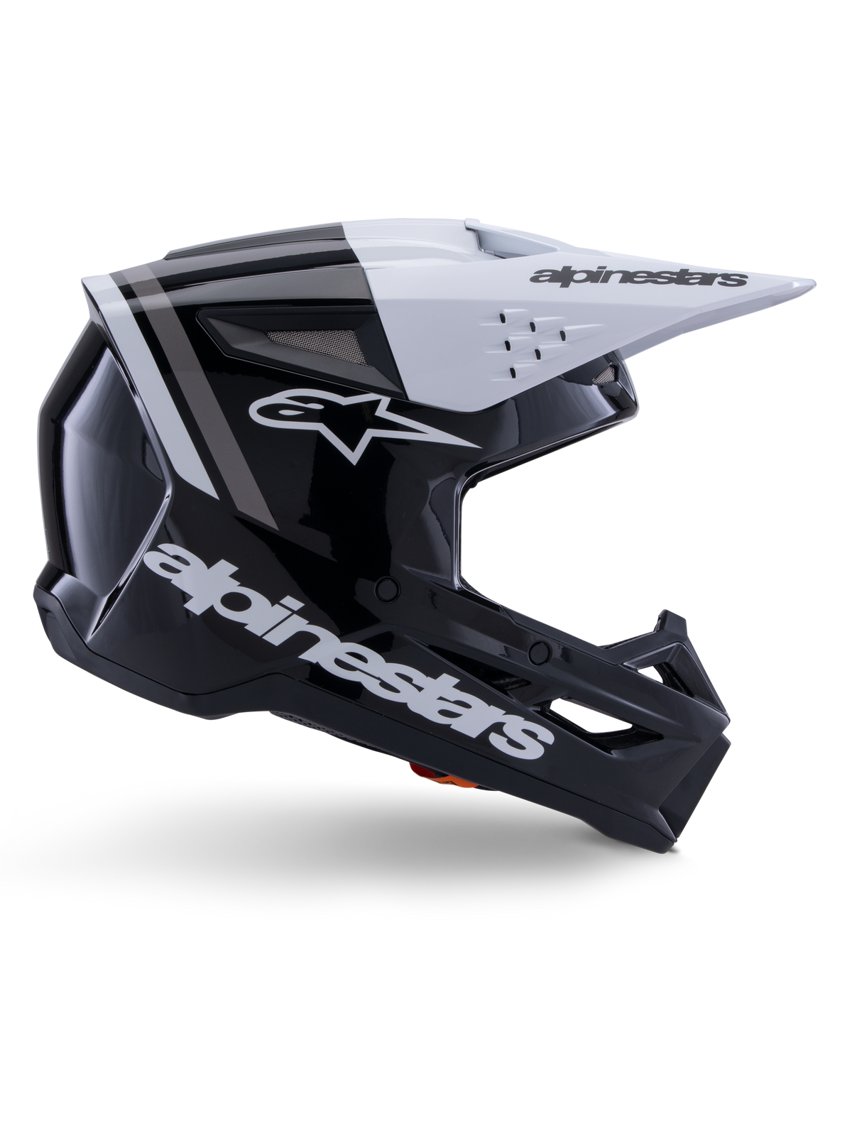 Kask Alpinestars S-M3 Radium, kask motocrossowy off-road, czarno-biało-szary z połyskiem, kanciasty aerodynamiczny design z otworami wentylacyjnymi, widok z profilu, błyszczące wykończenie z szarymi pasami, biały daszek z logo Alpinestars