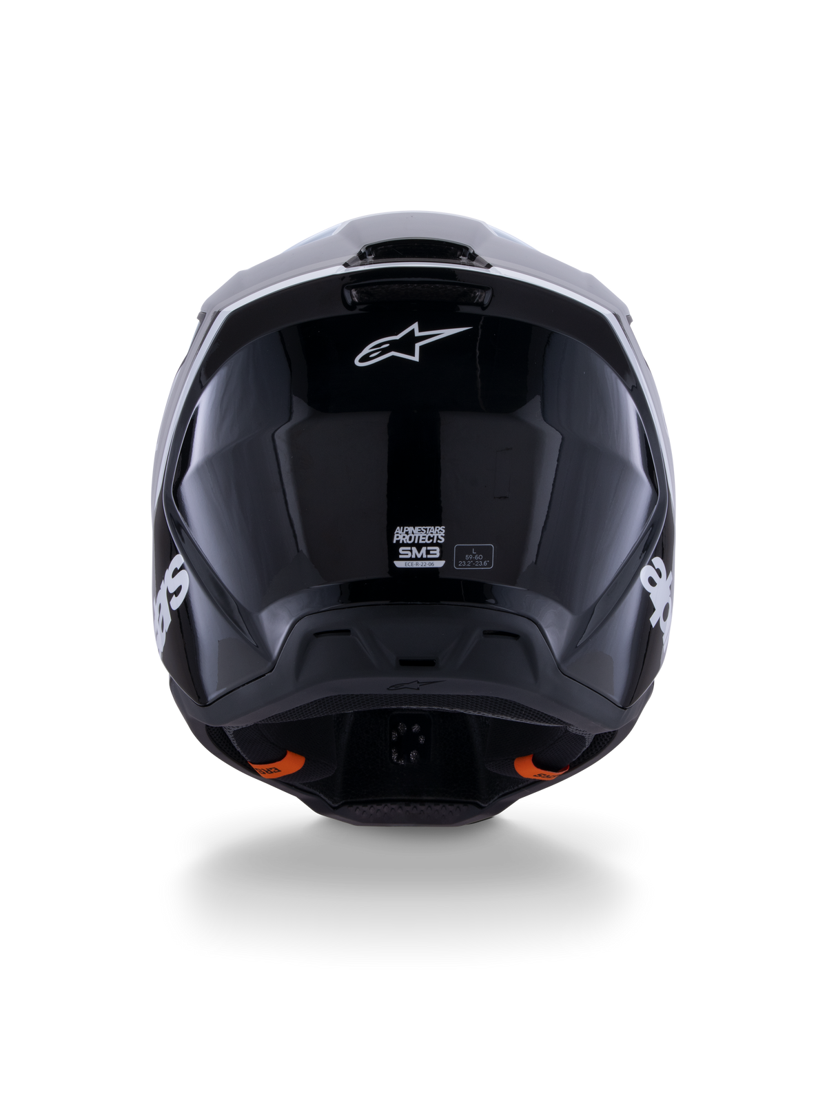 Kask Alpinestars S-M3 Radium ECE 22.06, kask motocrossowy, czarno-biało-szary z połyskiem, widok z tyłu prezentujący błyszczące czarne wykończenie, logo gwiazdy Alpinestars, otwory wylotowe wentylacji oraz etykietę certyfikacji ECE