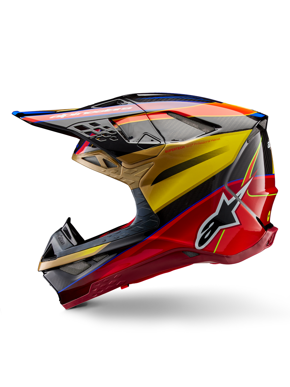 Kask Alpinestars Supertech M10 Era, kask motocrossowy, złoto-żółty i czerwony Rio Red z połyskiem, profil boczny z widoczną teksturą włókna węglowego i wyrazistą grafiką, logo gwiazdy Alpinestars, aerodynamiczny kształt z licznymi otworami wentylacyjnymi, profesjonalna ochrona do jazdy w terenie