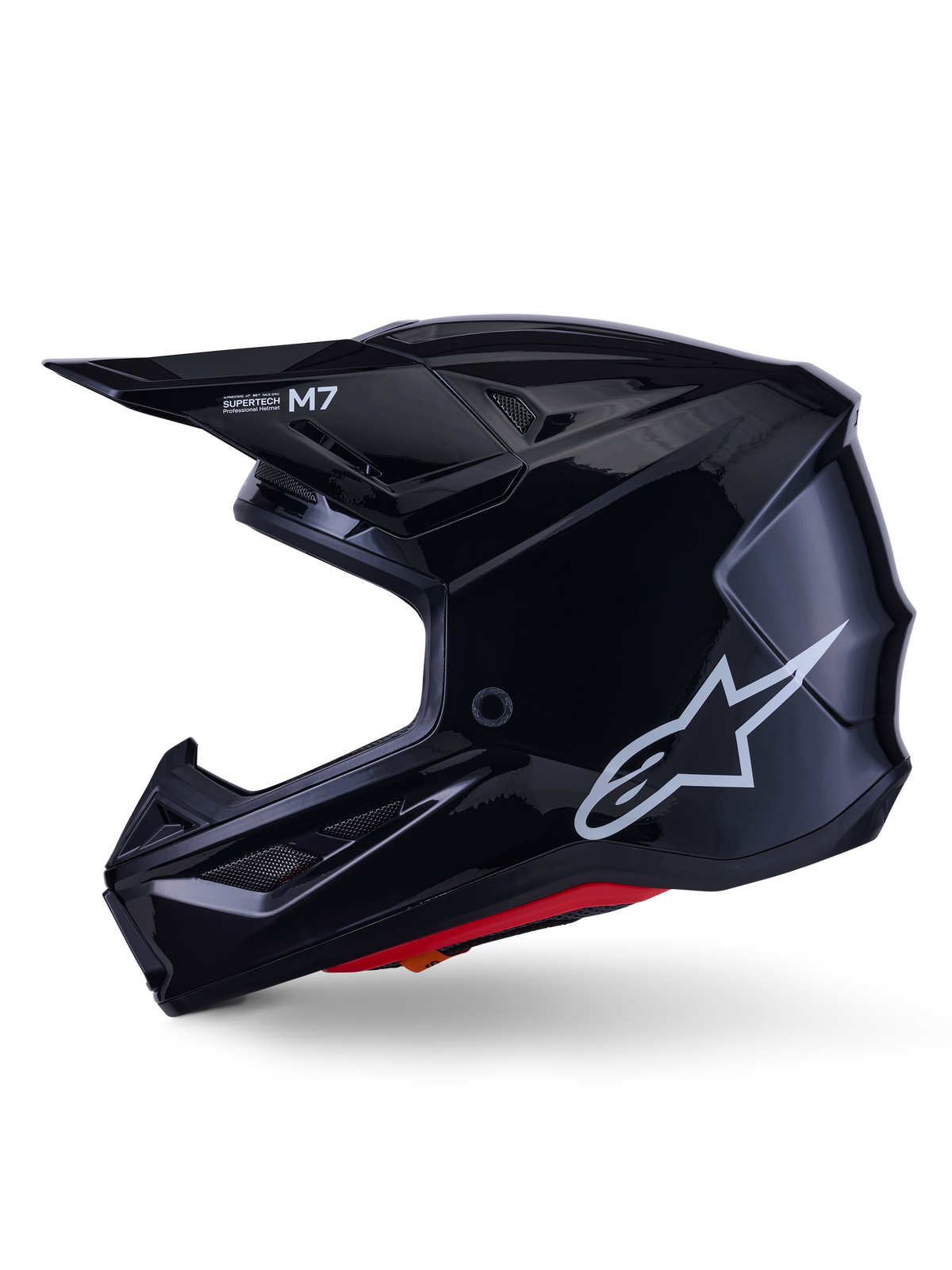 Alpinestars S-M7 Solid Helmet, kask motocrossowy w kolorze błyszczącej czerni, profil boczny z białym logo Alpinestars, aerodynamiczna skorupa z siatką wentylacyjną i czerwoną wyściółką wewnętrzną, zaawansowana ochrona off-road