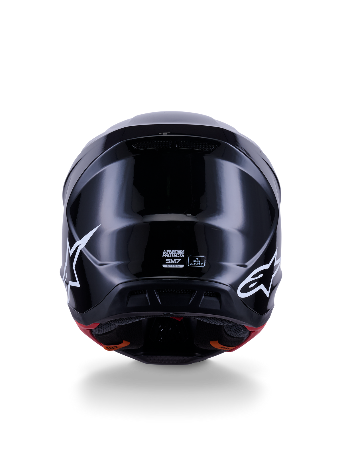 Alpinestars S-M7 Solid Helmet ECE 22.06, kask motocrossowy, czarny połysk, widok z tyłu z białymi logo gwiazdy, aerodynamiczna kompozytowa skorupa z wykończeniem na wysoki połysk, certyfikat bezpieczeństwa i oznaczenie rozmiaru na środku