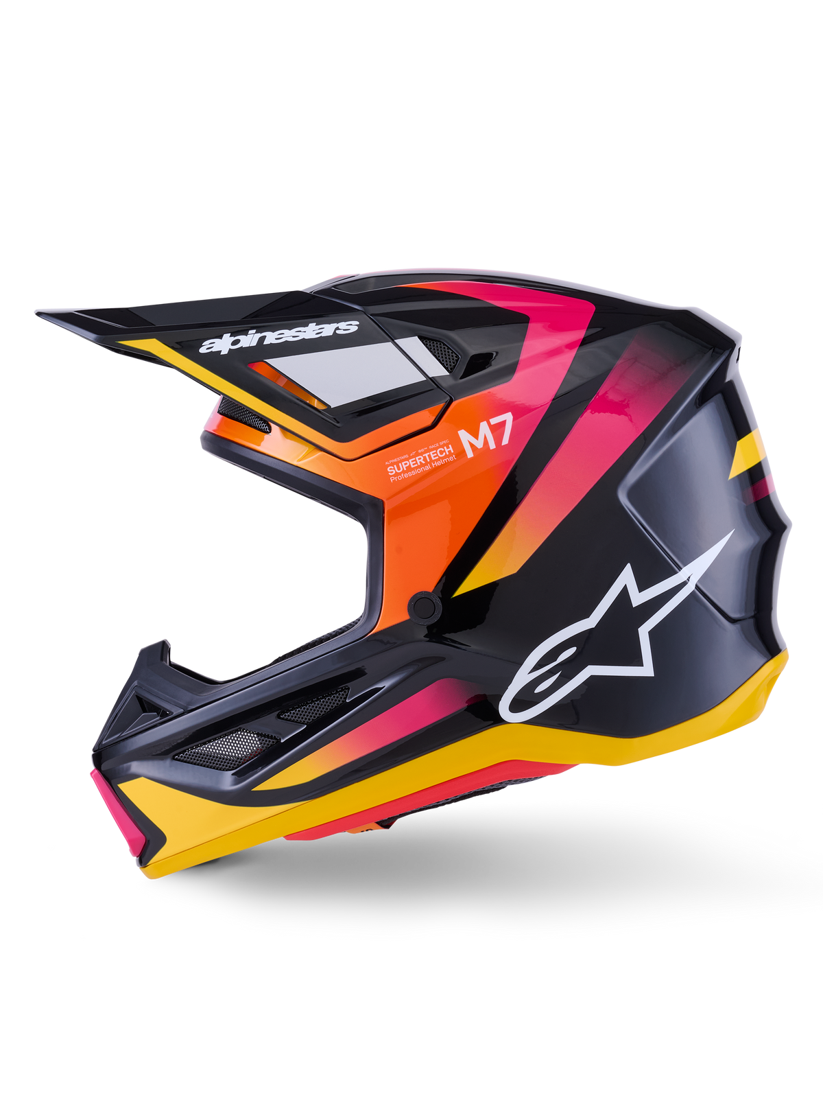 Kask Alpinestars S-M7 Rise, kask motocrossowy, czarny, żółty i różowy z połyskiem, profil boczny prezentujący żywe pomarańczowe i różowe akcenty gradientowe, białe logo Alpinestars, opływowa aerodynamiczna konstrukcja z czarnym daszkiem, profesjonalna ochrona głowy do wyścigów terenowych