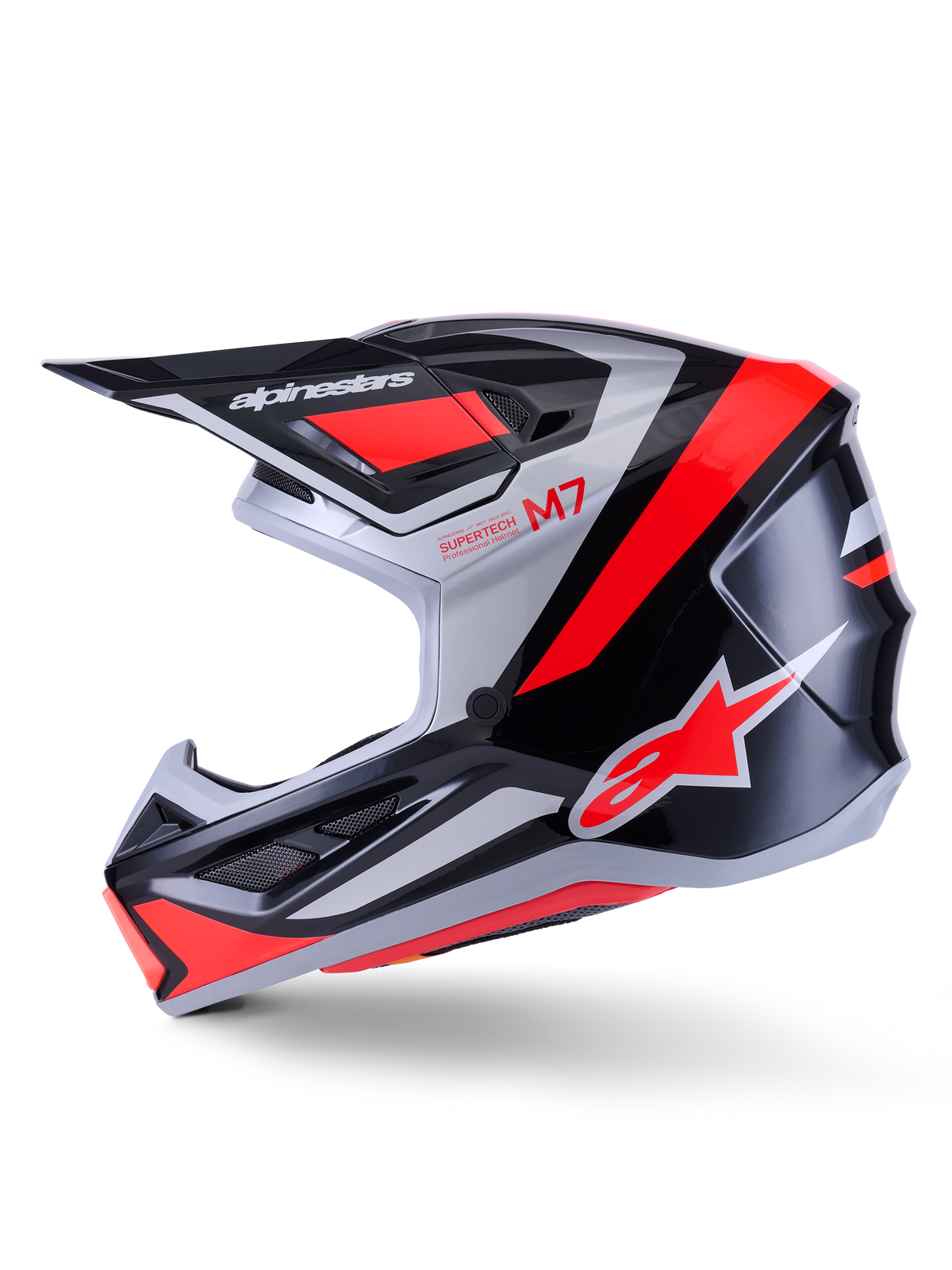 Alpinestars S-M7 Rise Helmet, kask motocrossowy, czarny, srebrny i czerwony fluo z połyskiem, widok z profilu, aerodynamiczna skorupa kompozytowa, wentylowana osłona szczęki, wydatny daszek z logo Alpinestars