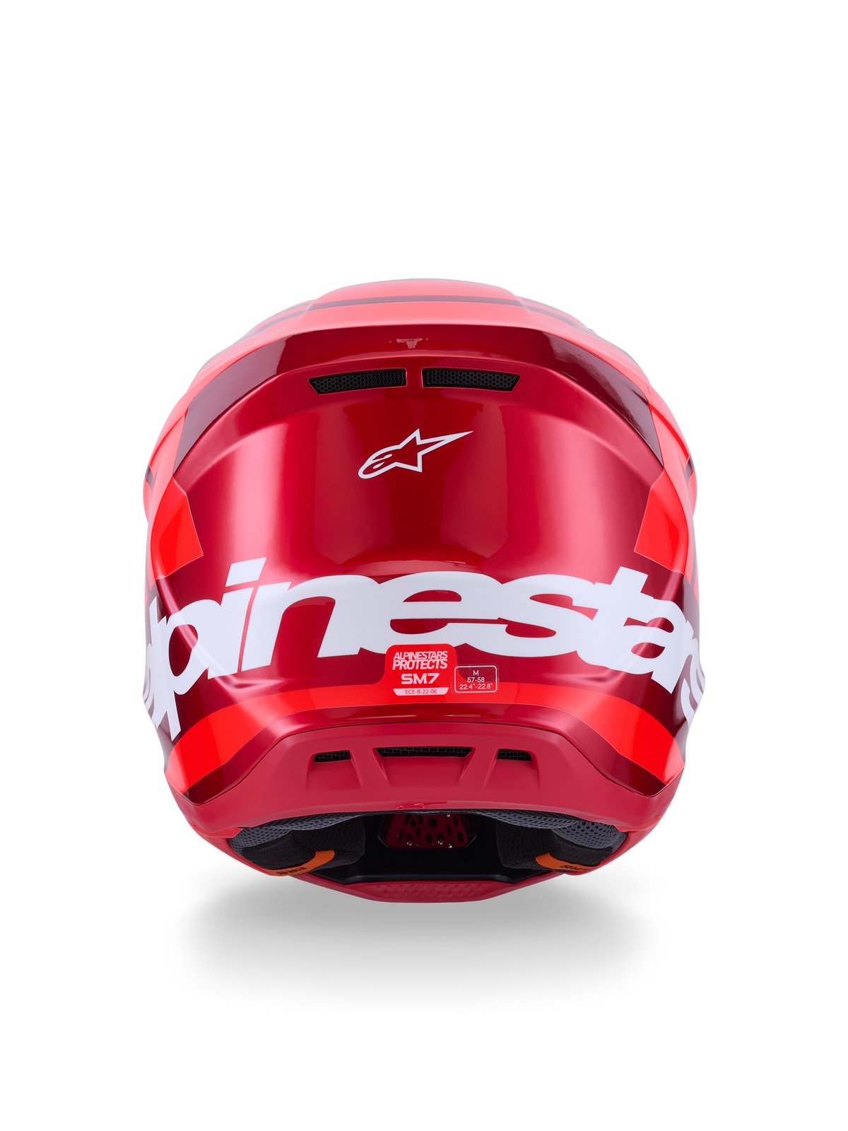 Kask Alpinestars S-M7 Core, czerwony błyszczący, widok z tyłu z dużym białym brandingiem Alpinestars, aerodynamiczna skorupa ze zintegrowanymi otworami wentylacyjnymi, profesjonalna ochrona głowy do motocrossu