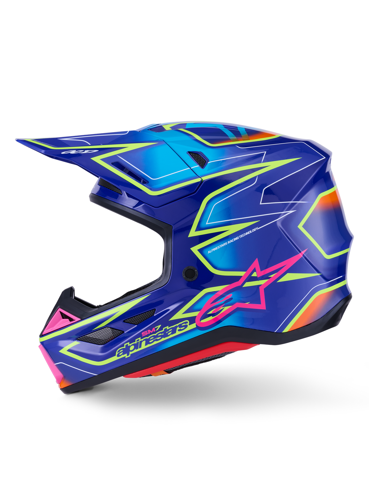 Alpinestars S-M7 Cast Helmet, kask motocrossowy, niebieski z różowymi i żółtymi błyszczącymi akcentami fluo, widok z boku prezentujący aerodynamiczną skorupę kompozytową, zintegrowane otwory wentylacyjne, różowe logo z gwiazdą i żółte oznaczenia marki, zaprojektowany z myślą o ochronie w wyścigach terenowych.
