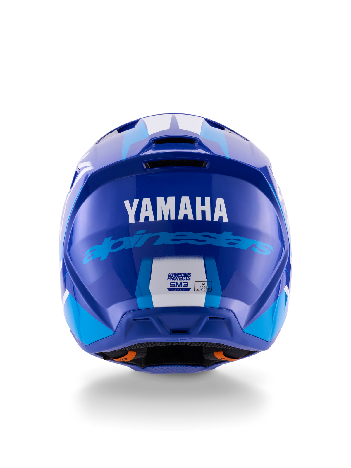 Kask Alpinestars Yamaha S-M3, kask motocrossowy, niebiesko-biały z połyskiem, widok z tyłu pokazujący białe logo YAMAHA i niebieski napis Alpinestars, błyszczące wykończenie z widocznymi otworami wentylacyjnymi i etykietami certyfikacji bezpieczeństwa