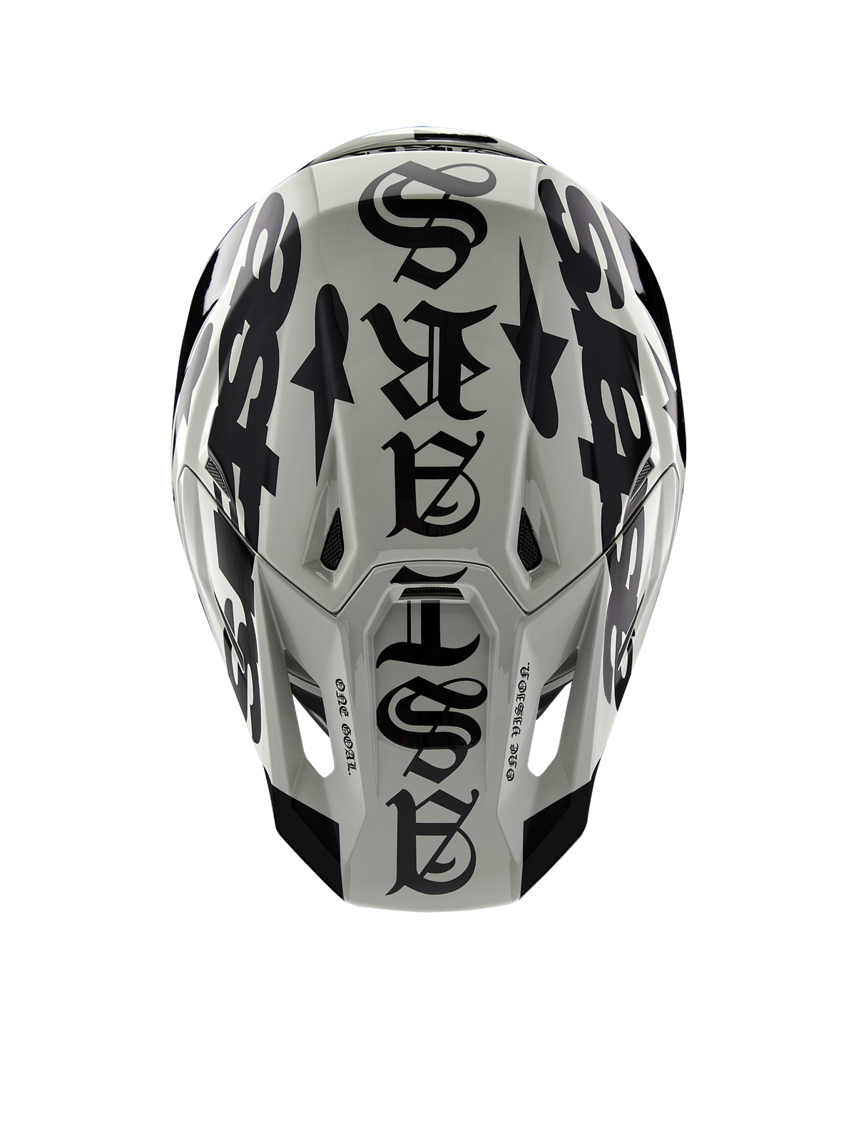Kask Alpinestars Limited Edition S-M7 Wolf Dust, widok z góry, połyskujące wykończenie w kolorach Dune i czarnym, z wyrazistą typografią w stylu gotyckim na górze skorupy i detalami One Goal One Vision, profesjonalna ochrona głowy do wyścigów motocrossowych