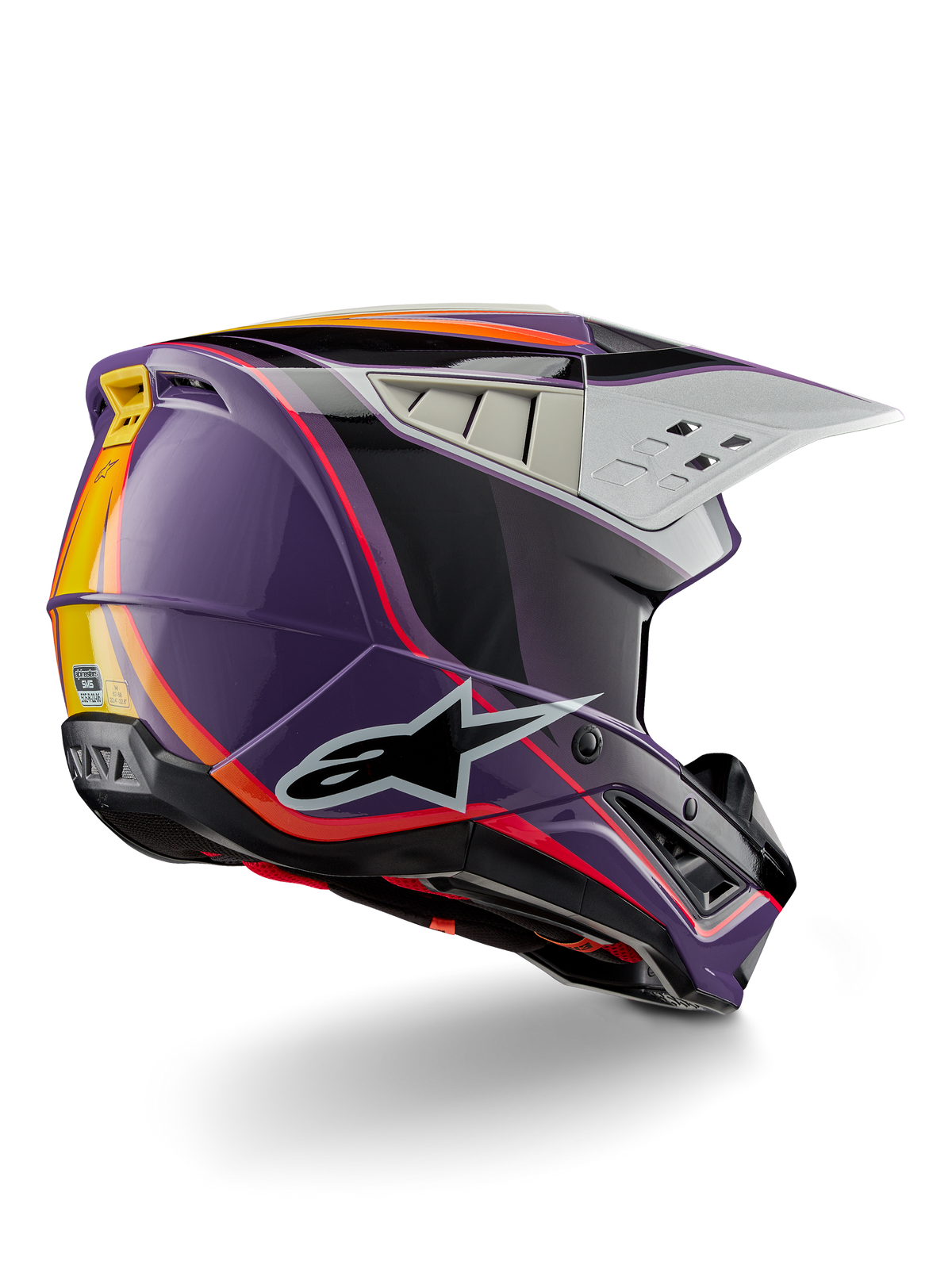 Alpinestars S-M5 Sail Helmet ECE, kask motocrossowy, fioletowo-czarno-srebrny z połyskiem, pomarańczowe i żółte akcenty w formie pasów, duże czarne logo gwiazdy, aerodynamiczny profil z tylnymi otworami wentylacyjnymi, połyskujące wykończenie do wyścigów terenowych