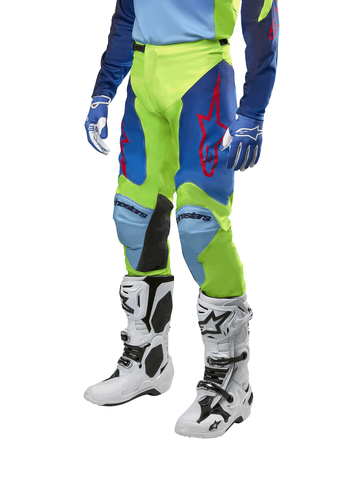 Alpinestars 2024 Racer Hoen Pants, Motocross Pants, Yellow Fluo and Blue Night Navy, featuring red star logos and black inner knee panels, worn with a matching jersey and white motocross boots, performance gear for off-road racing