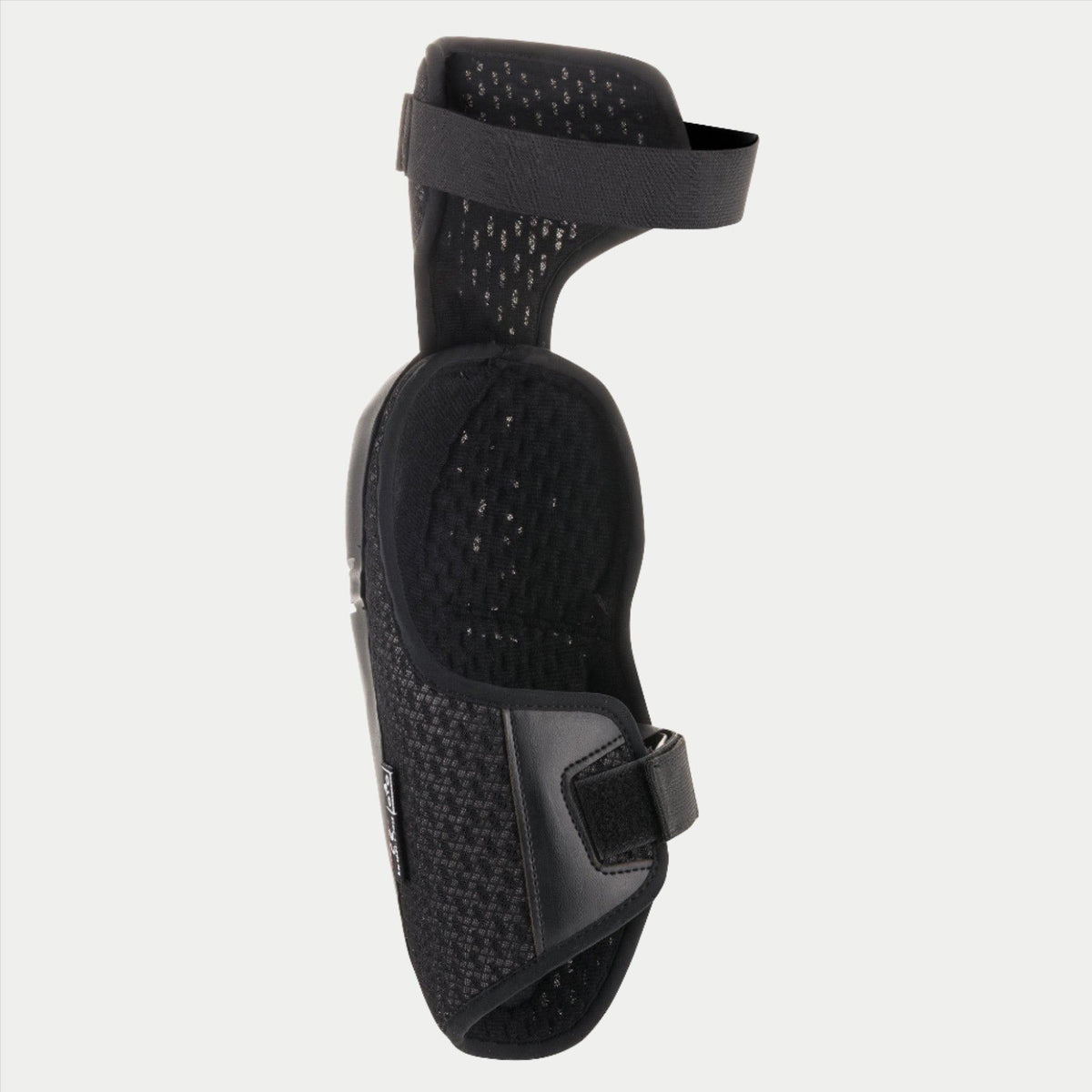 Alpinestars Youth Bionic Plus Knee Protector, Black, showing the interior mesh lining and dual strap closure system, ergonomic design for off-road motocross protection