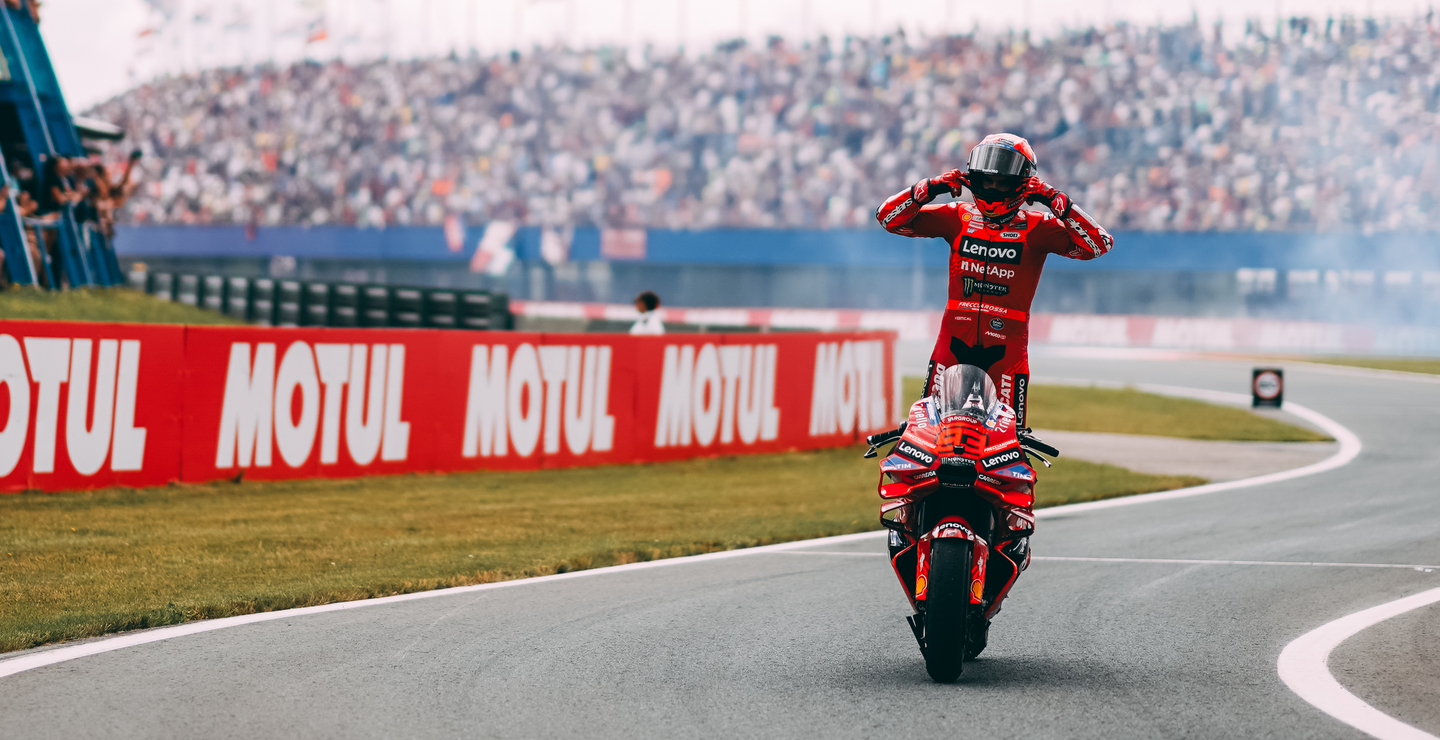 Marc Marquez celebrating a victory wearing Alpinestars gear