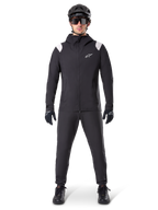 Alpinestars A-Dura Rain Jacket, Mountain Bike Rain Jacket, Black with white shoulder accents and white logo on chest, worn with black pants, black helmet, sunglasses, and gloves, coordinated mountain biking gear for wet weather
