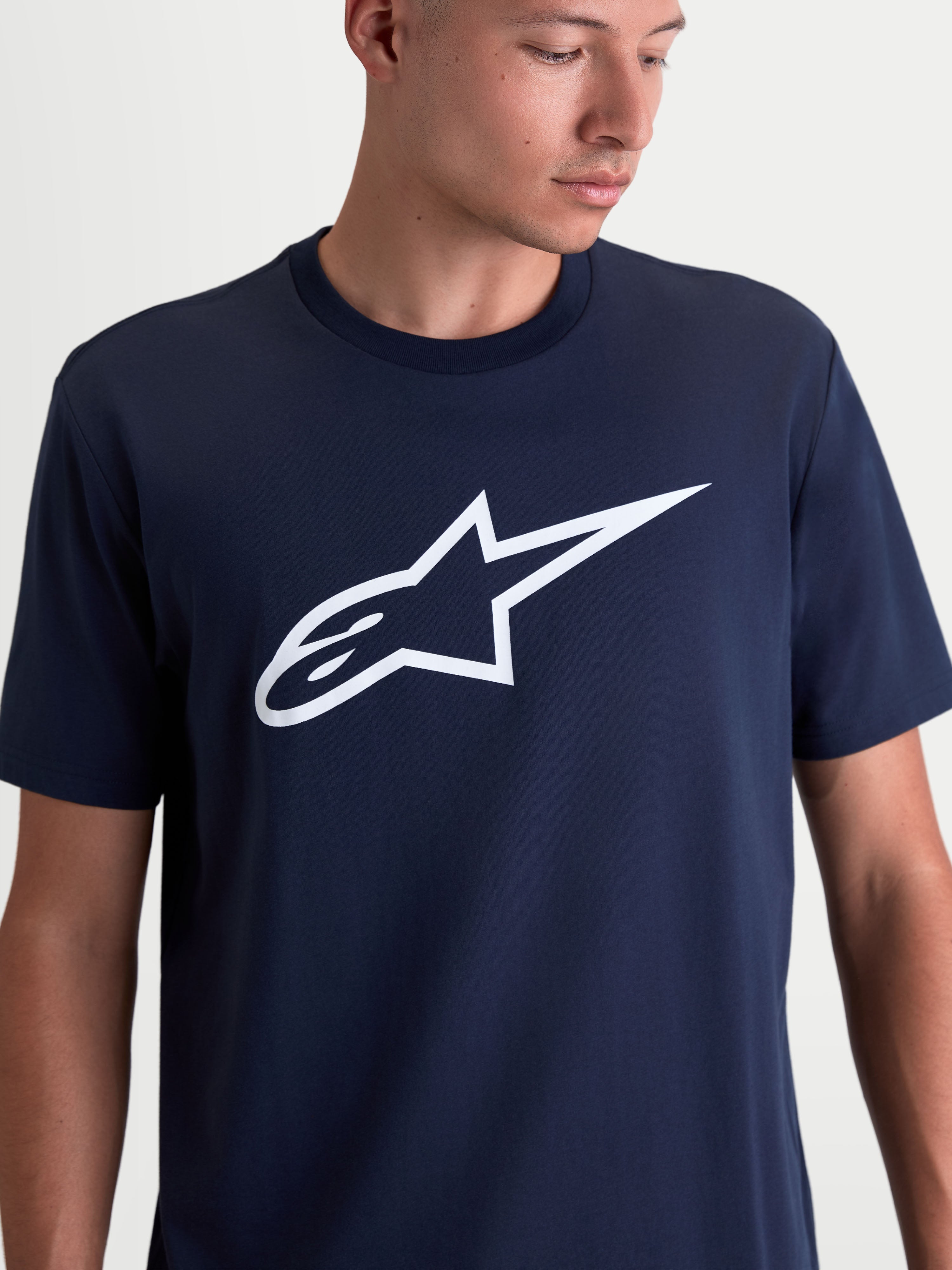 Alpinestars Ageless 2.0 CSF Tee, Men's Sportswear T-Shirt, Navy Blue with White Logo, featuring a soft-hand Ageless logo graphic on the chest, 60/40 cotton-poly blend, cut-and-sew fit for everyday wear.