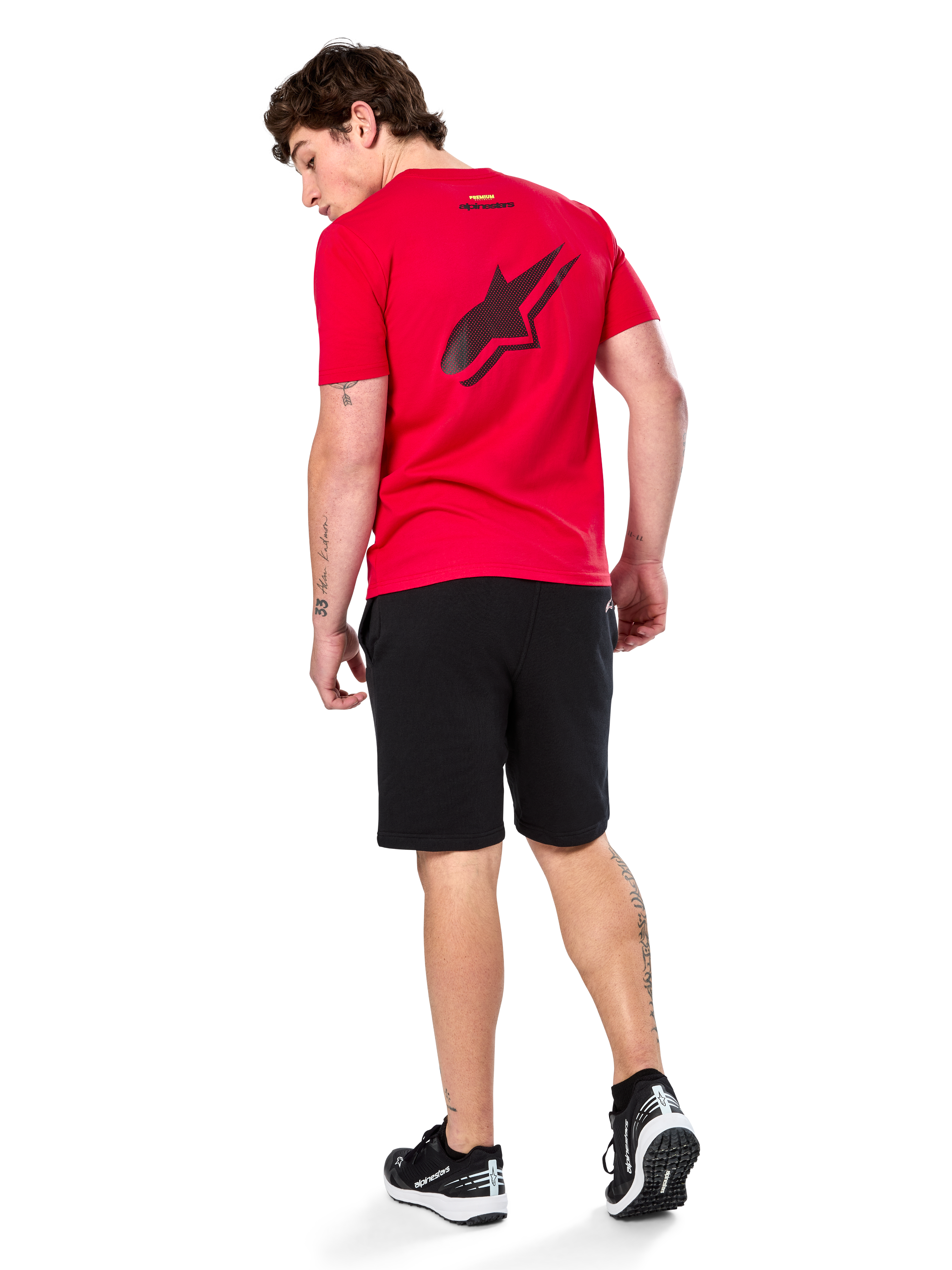 Alpinestars Formulate Csf Tee, Short Sleeve T-Shirt, Red, Large black perforated Astars logo on the back, worn with black shorts and sneakers, casual motorsport-inspired streetwear