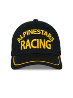 Alpinestars Luminary Hat, czarna czapka z daszkiem typu snapback, żółty haft 3D Alpinestars Racing z przodu, zakrzywiony daszek z żółtą lamówką sutache, sportowe nakrycie głowy