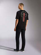 Alpinestars Overhang Oversized CSF Tee, koszulka z krótkim rękawem, czarna, z pionowym czerwonym logotypem i okrągłą białą grafiką na plecach, casualowa odzież streetwear w stylu motorsport