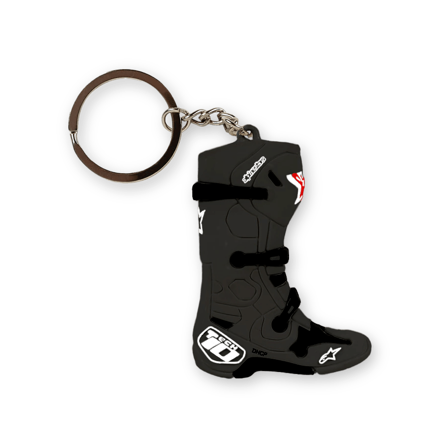 Brelok Alpinestars New Tech 10 Boot, czarny z białymi i czerwonymi akcentami, trójwymiarowa miniatura kultowego buta motocrossowego, szczegółowo odwzorowane klamry i logo, srebrne metalowe kółko na klucze