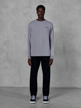 Alpinestars Essentials Ageless LS Tee, Long Sleeve T-Shirt, Silver, small black Alpinestars logo on the chest, organic cotton jersey with stone wash finish, worn by a model with black pants and sneakers, casual streetwear