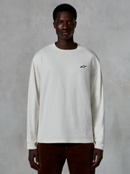 Alpinestars Essentials Ageless LS Tee, Long Sleeve T-Shirt, Off White, small black star logo on the chest, casual streetwear, relaxed fit, worn by a model