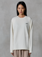 Alpinestars Essentials Ageless LS Tee, Long-Sleeve T-Shirt, Off White, featuring a small black star logo on the chest, relaxed contemporary fit, organic cotton jersey, casual motorsport-inspired streetwear