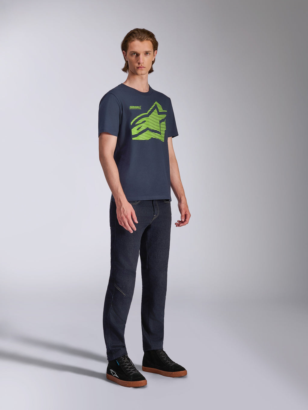 Alpinestars Fasting CSF Tee, Short Sleeve T-Shirt, Navy Blue, Lime Green Geometric Astars Logo, worn with dark jeans and black sneakers, Casual Motorsport Streetwear