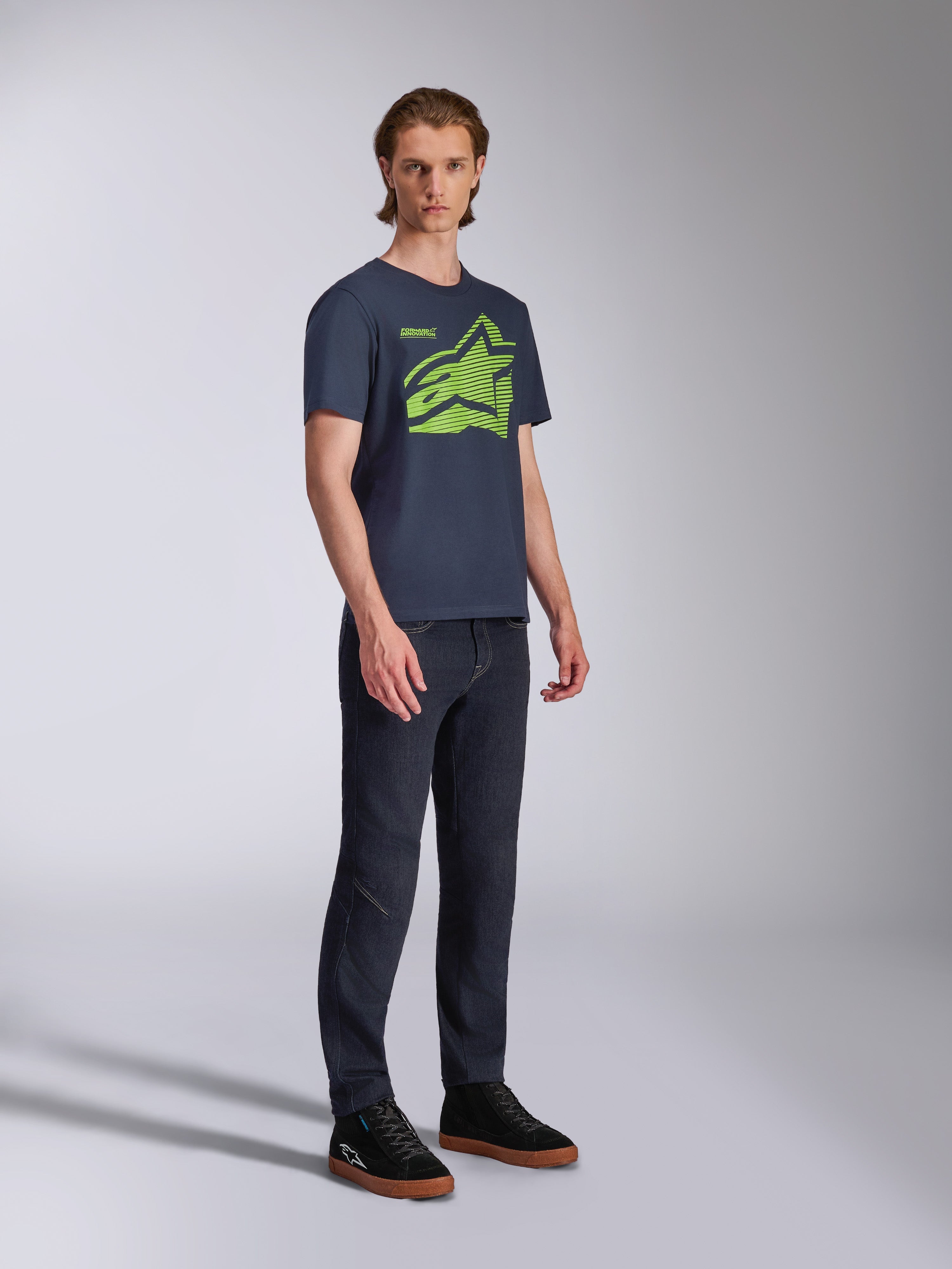 Alpinestars Fasting CSF Tee, Short Sleeve T-Shirt, Navy Blue, Lime Green Geometric Astars Logo, worn with dark jeans and black sneakers, Casual Motorsport Streetwear