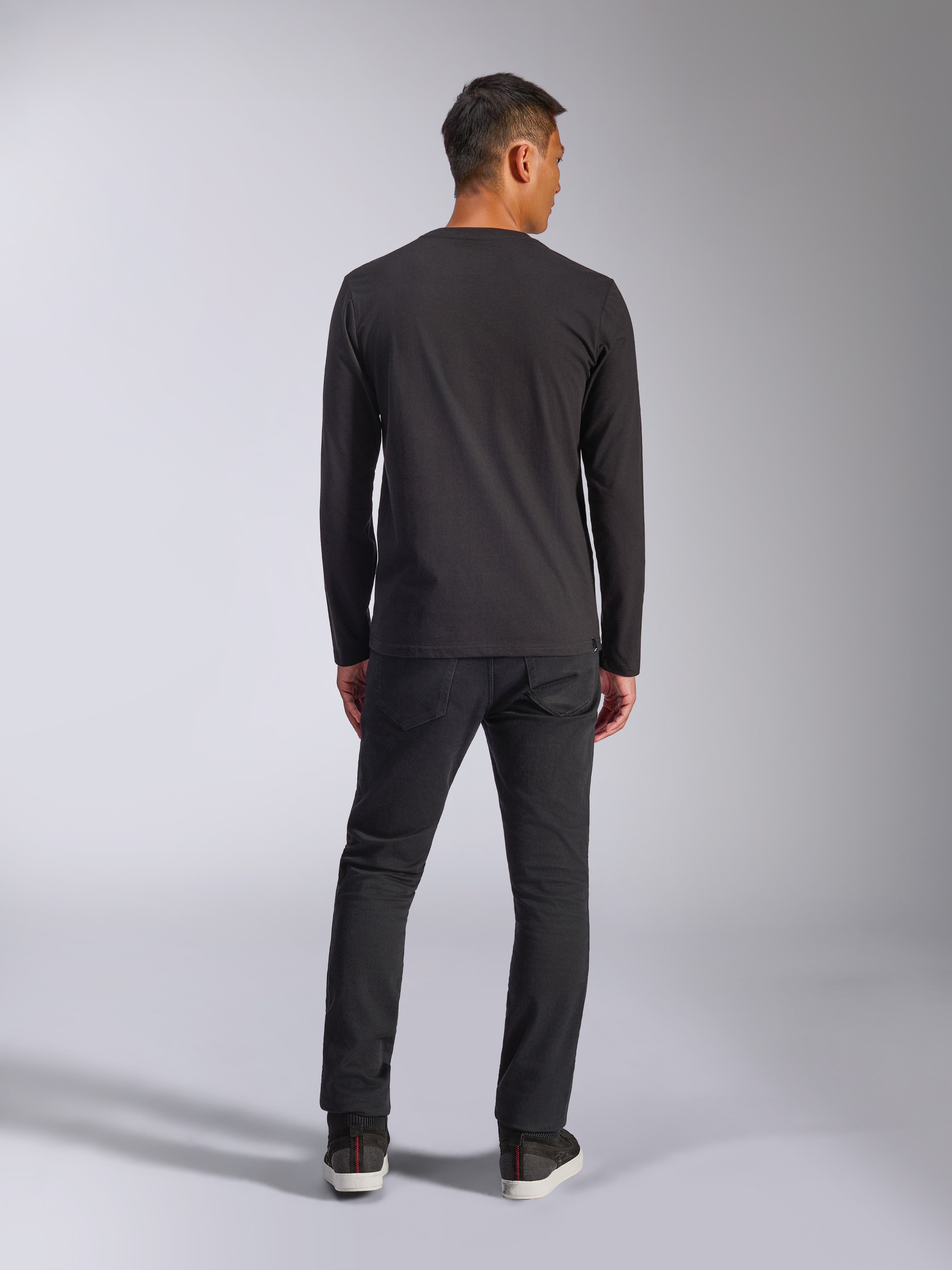 Alpinestars Trackside CSF Tee, Long Sleeve T-Shirt, Black, Back view of model wearing the shirt with dark pants, casual motorsport-inspired streetwear