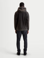 Alpinestars Infinite Washed Oversized Hoodie, bluza z kapturem, casualowa odzież sportowa, unisex, czarna z efektem snow-wash, miękki polar, widok z tyłu pokazujący luźny krój, kaptur i prążkowany dół.
