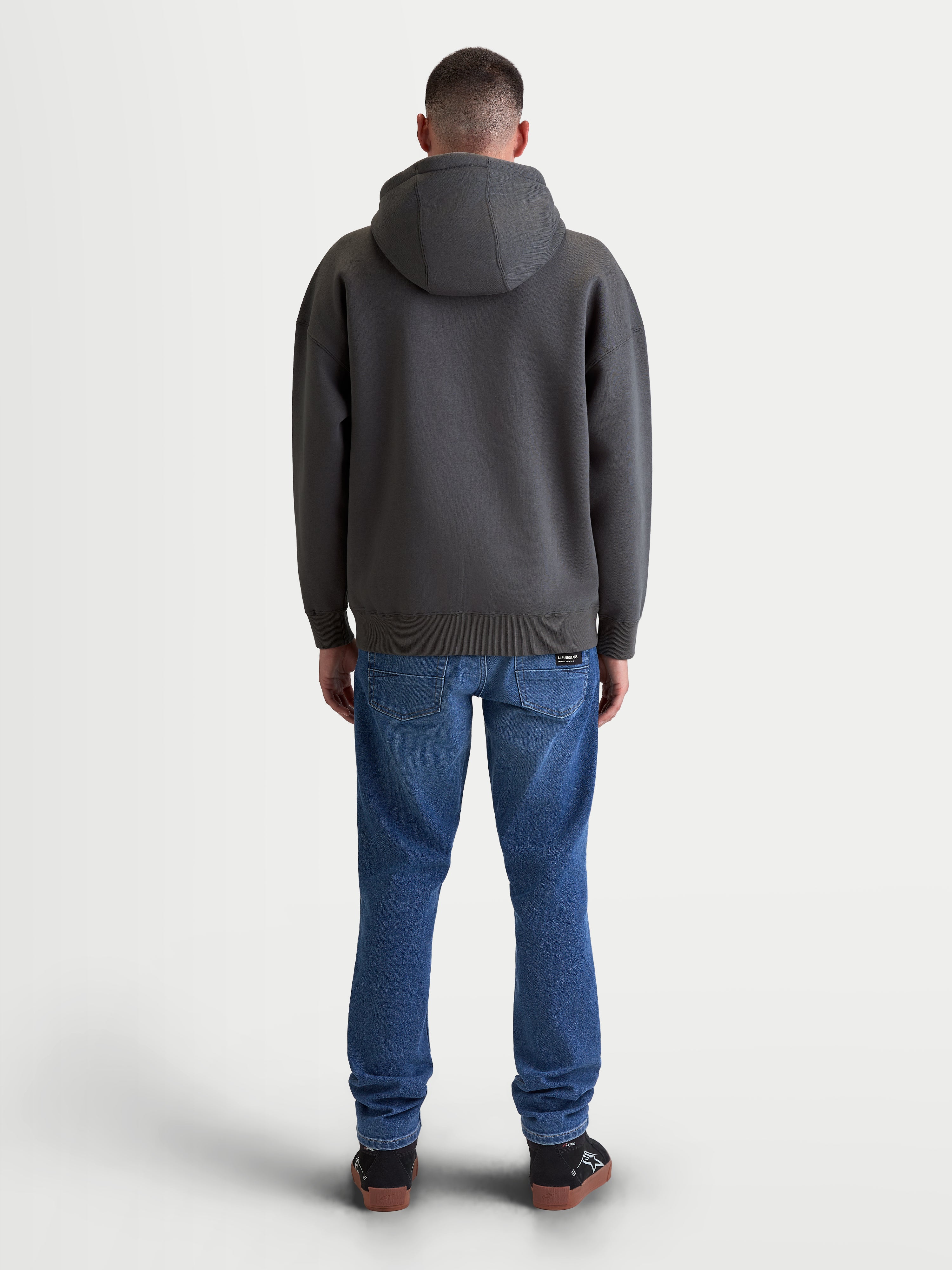 Alpinestars bluza z kapturem Prelude Oversize, męska sportowa bluza polarowa, szara, widok z tyłu pokazujący luźny krój oversize, kaptur z podszewką i prążkowane wykończenia dla codziennego komfortu.